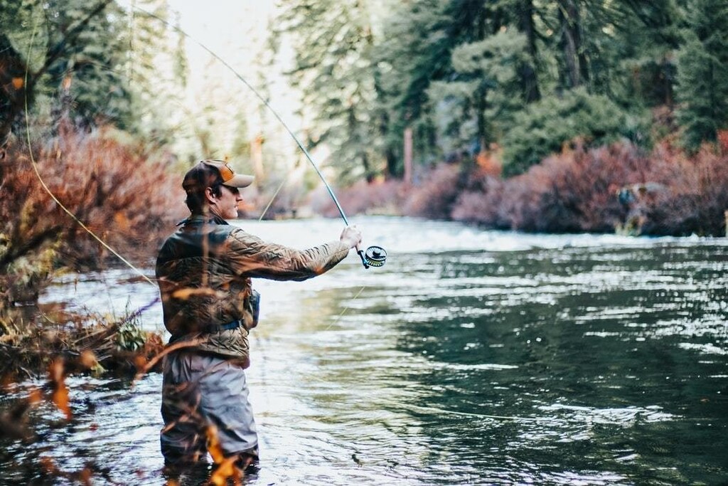 image of man fishing in freshwater