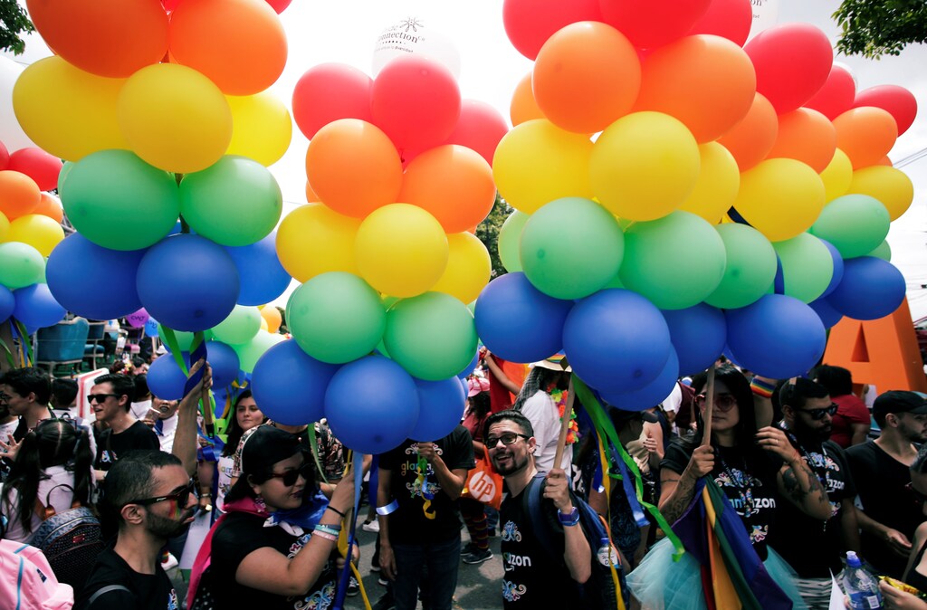 People take part in the annual Gay Pride parade along the Central Avenue, in San Jose, Costa Rica June 23, 2019. REUTERS/Juan Carlos Ulate - RC1DEE7746E0