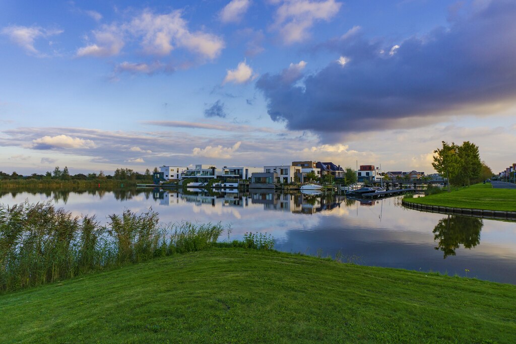 Waterfront villas in Almere Noorderplassen, Flevoland, The Netherlands. Caption: Almere, Netherlands, is an example of a city that has outlined zero-carbon urban plans in the 2024 Reinventing Cities competition run by global city mayor network C40.