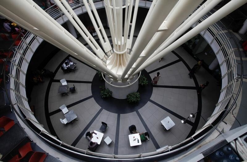 A general view shows workers at a cafeteria inside a building at the Infosys campus at the Electronic City area in Bangalore September 4, 2012. REUTERS/Vivek Prakash/File Photo GLOBAL BUSINESS WEEK AHEAD PACKAGE SEARCH BUSINESS WEEK AHEAD 10 OCT FOR ALL IMAGES - S1BEUGBYZDAB