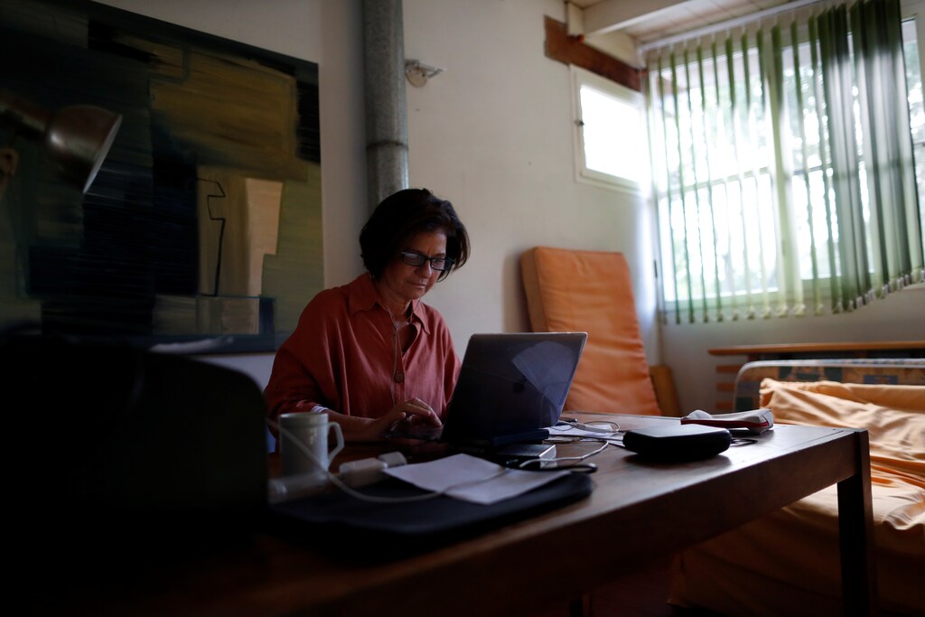 Psychoanalyst Roxana Meygide Schargorodsky works by video call with a patient, at her home in Buenos Aires, Argentina April 7, 2020. Picture taken April 7, 2020