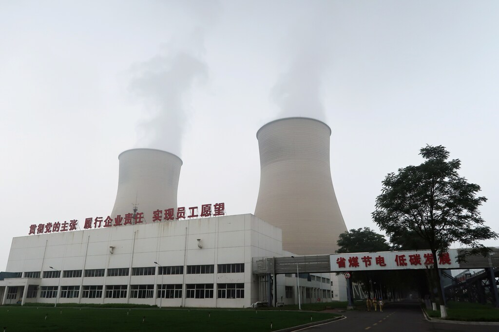 Smoke is seen from cooling towers of a China Energy ultra-low emission coal-fired power plant during a media tour, in Sanhe, Hebei province, China July 18, 2019. Picture taken July 18, 2019. REUTERS/Shivani Singh - RC121189B1D0