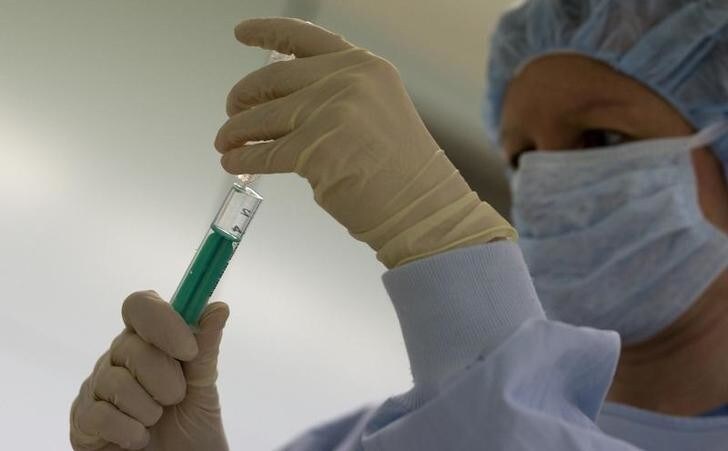 A surgery nurse prepares a syringe during procedures to clean the wound of an amputee patient with MRSA (Methicillin resistant Staphylococcus Aureus) in the operating theatre at the Unfallkrankenhaus Berlin (UKB) hospital in Berlin February 29, 2008. MRSA is an antibiotic resistant so-called 'super-bug', which can cause deadly infections. REUTERS/Fabrizio Bensch (GERMANY)