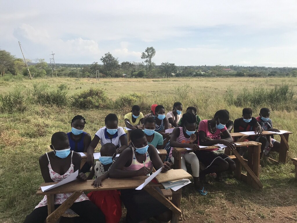Girls in Siaya, Kenya, being trained to help spread the word about masks and hand-washing