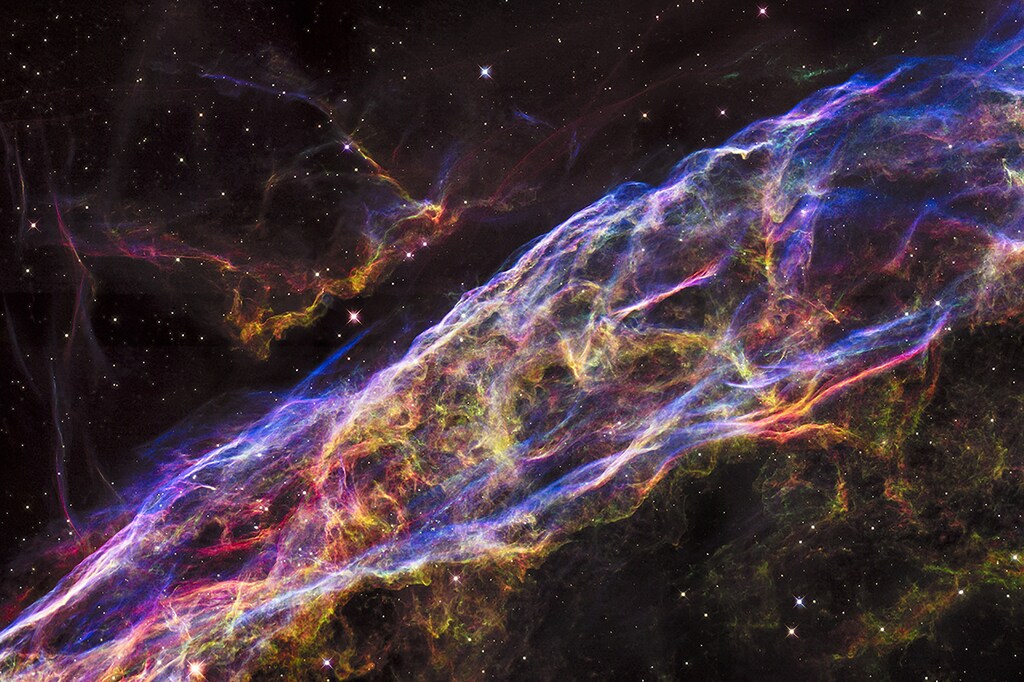 A small section of the expanding remains of the Veil Nebula, a massive star that exploded about 8,000 years ago, is seen in an image from NASA's Hubble Space Telescope released September 24, 2015. The entire nebula is 110 light-years across, covering six full moons on the sky as seen from Earth, and resides about 2,100 light-years away in the constellation Cygnus, the Swan, according to NASA. REUTERS/NASA/ESA/Hubble Heritage Team/Handout via Reuters THIS IMAGE HAS BEEN SUPPLIED BY A THIRD PARTY. IT IS DISTRIBUTED, EXACTLY AS RECEIVED BY REUTERS, AS A SERVICE TO CLIENTS. FOR EDITORIAL USE ONLY. NOT FOR SALE FOR MARKETING OR ADVERTISING CAMPAIGNS - RTX1S9VD