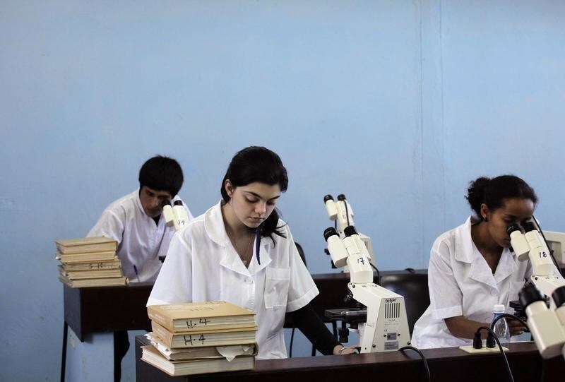 Medical students of Cuba's ELAM (Latin American School of Medicine) use microscopes during a cytology lesson in a campus lab on the outskirts of Havana March 15, 2010. Established in 1999 by former Cuban leader Fidel Castro and operated by the Cuban government, the students enrolled in the ELAM are international students from outside Cuba and mainly come from Latin America and the Caribbean as well as Africa, the Middle East and Asia. The school also accepts students from the United States.