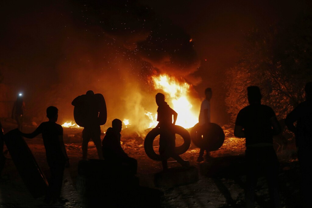 demonstrators protest signifying the rise in pandemic-related violence between January 2020 and April 2021.