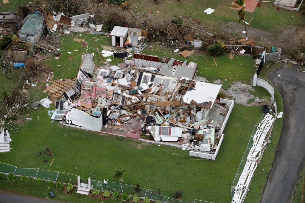A destroyed home is seen from a Marine Corps MV-22 Osprey surveying damage from Hurricane Maria in St. Croix, , U.S. Virgin Islands, September 21, 2017. REUTERS/Jonathan Drake TPX IMAGES OF THE DAY - RC1AA78A7300