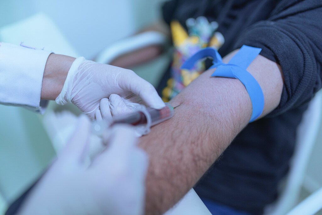 A doctor giving an injection to a patient.