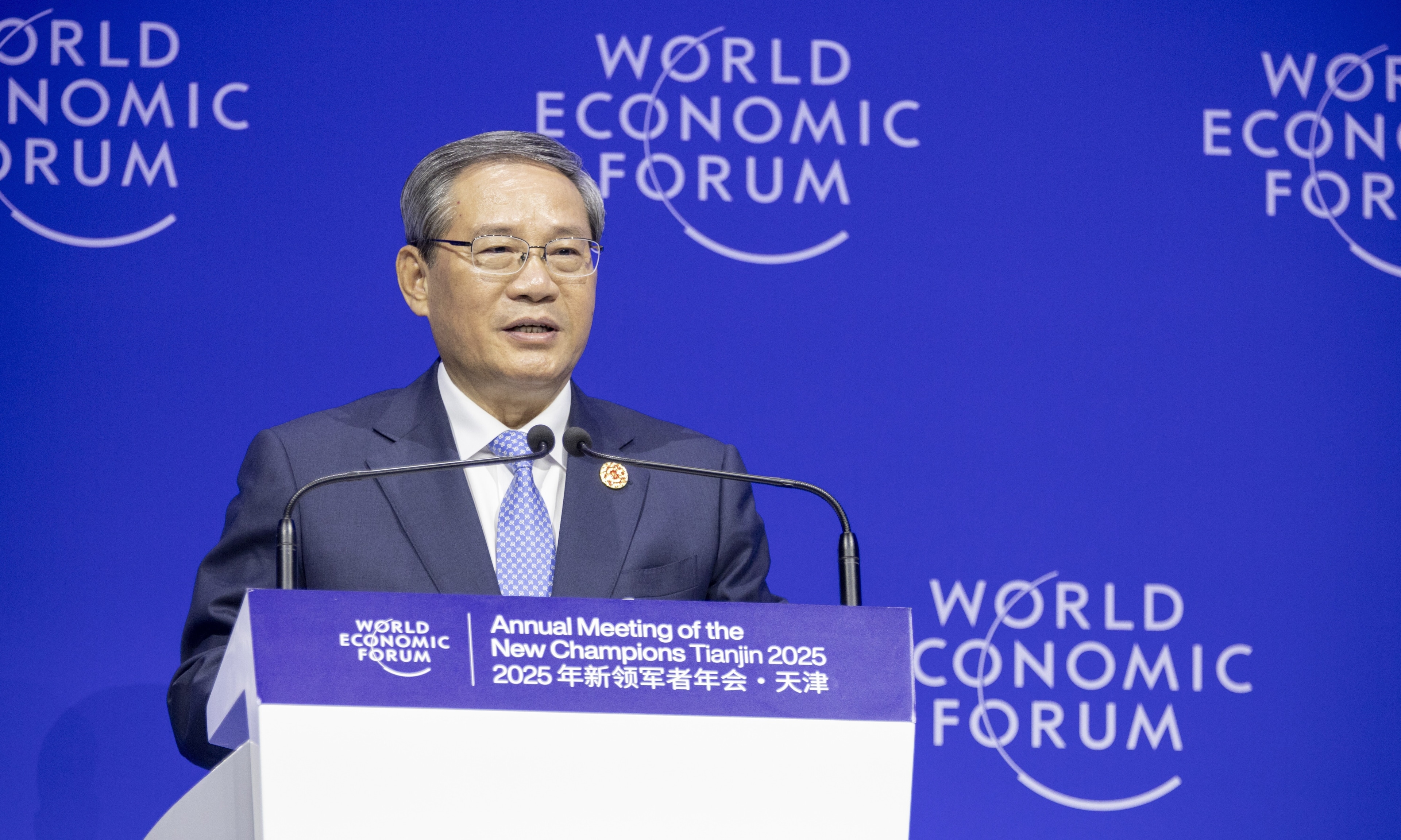 China Premier Li Qiang addresses an audience at the Opening Plenary of the World Economic Forum's Annual Meeting of the New Champions 2025.