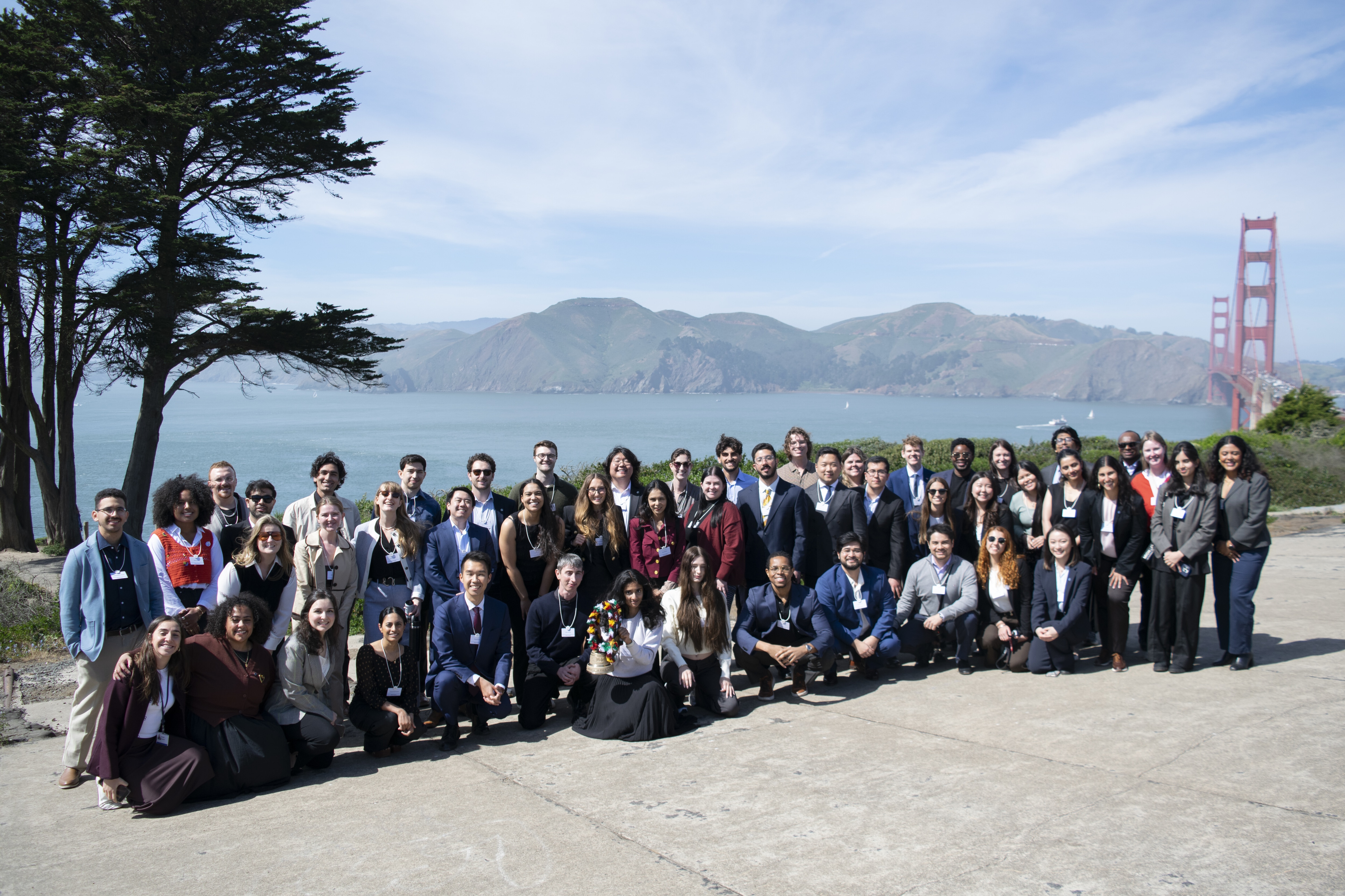 A group of young Global Shapers in fron tof the Golden Gate Bridge, California: Youth-led action is scalable when your target audience is aware of an existing problem and there is a clear pathway for change