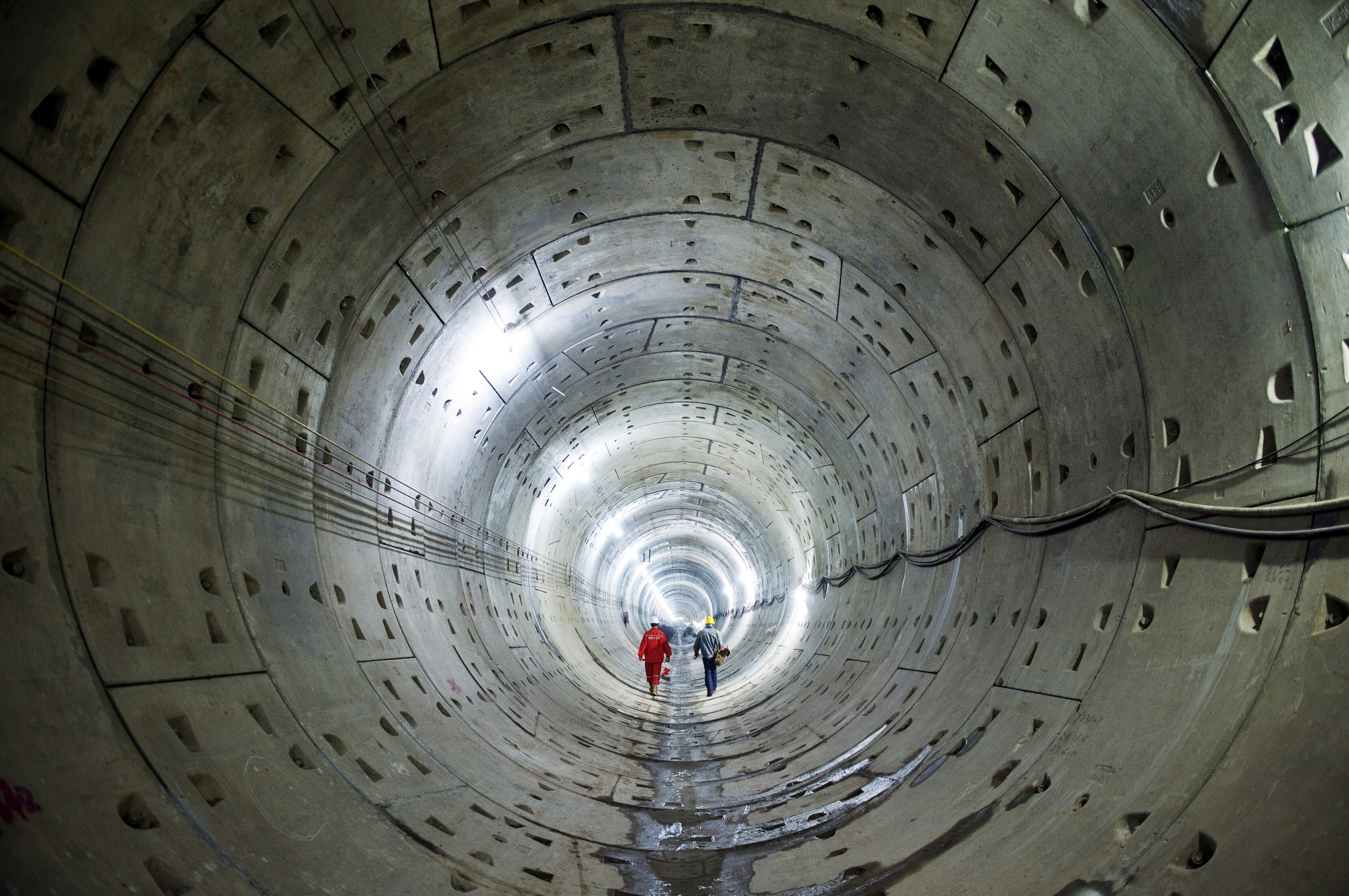 Patient capital: Workers walk along a tunnel of a subway construction site in Changsha, Hunan province, China, October 11, 2015.