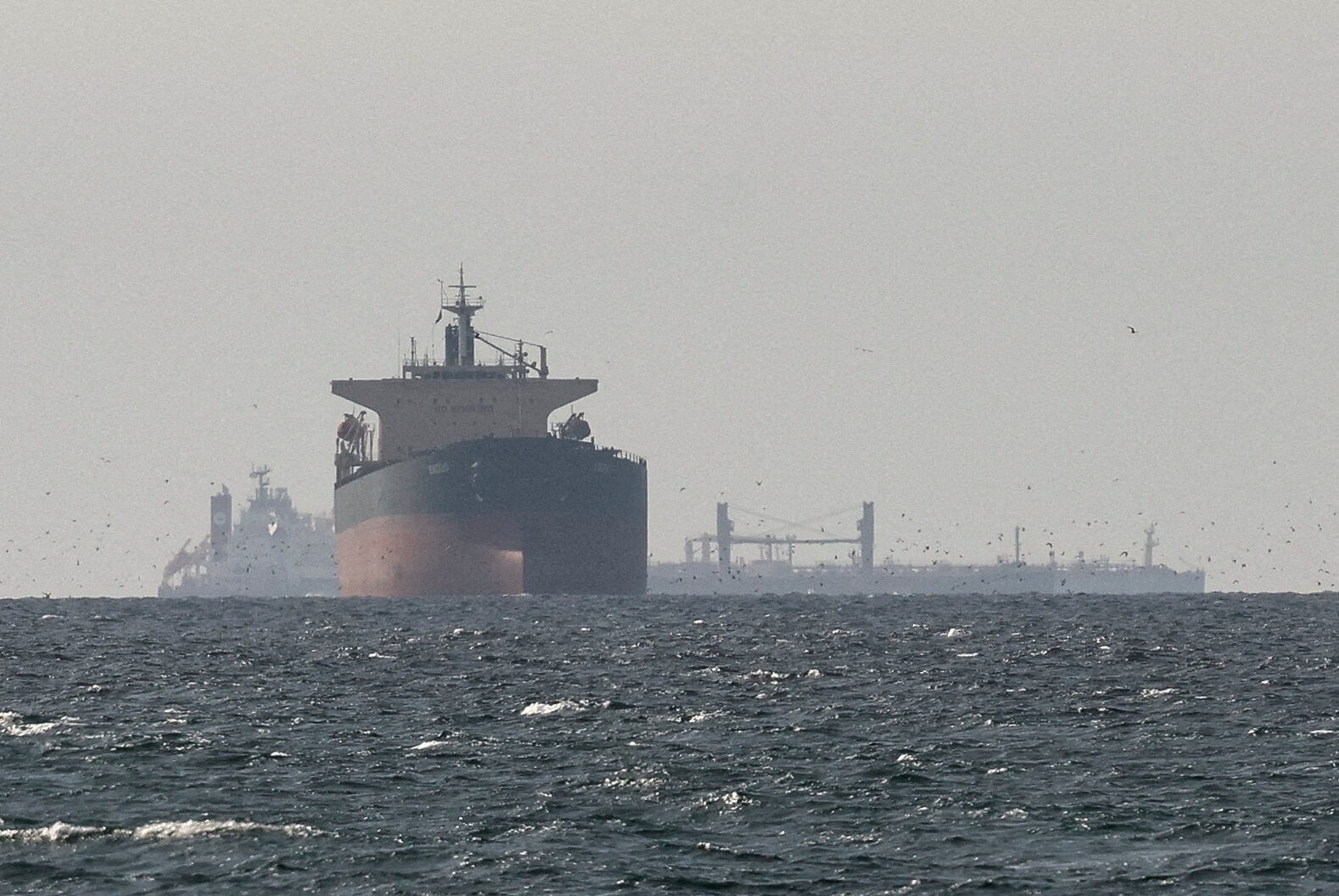 FILE PHOTO: Tankers sail in the Gulf, near the Strait of Hormuz, as seen from northern Ras al-Khaimah, near the border with Omanâs Musandam governance, amid the U.S.-Israeli conflict with Iran, in United Arab Emirates, March 11, 2026. REUTERS/Stringer/File Photo