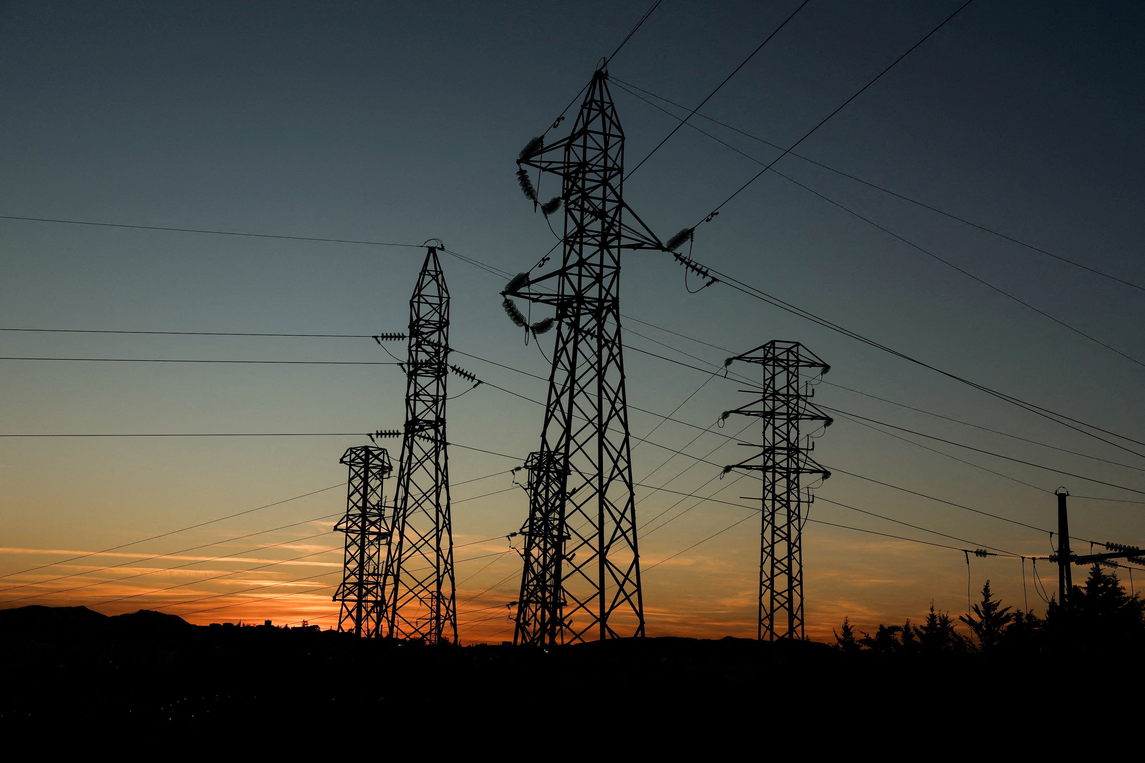 Power lines connecting pylons of high-tension electricity are seen during sunset at an electricity substation on the outskirts of Ronda, during a blackout in the city, Spain April 28, 2025
