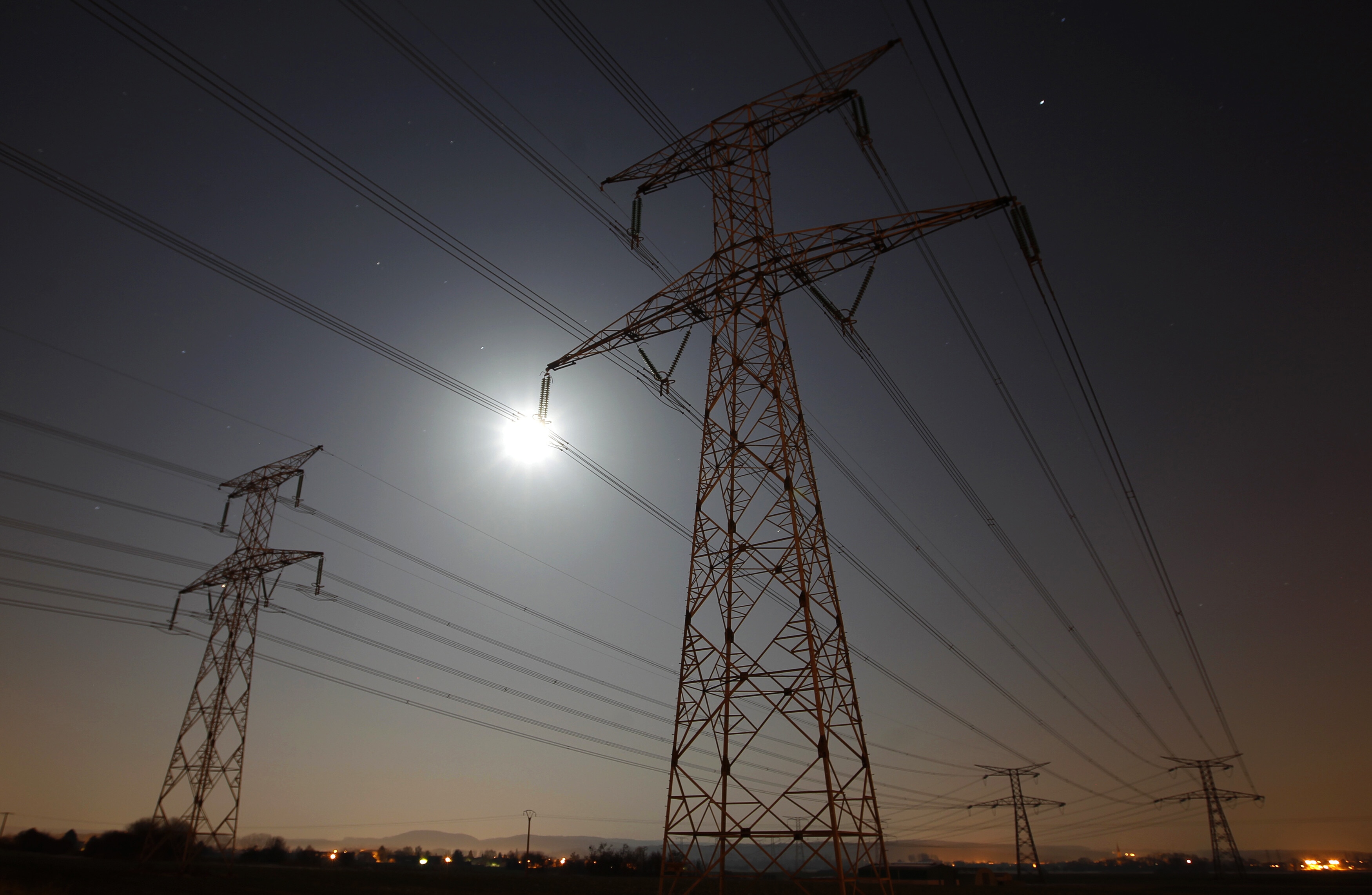High voltage power lines are seen at night in Cattenom near Thionville, Eastern France.