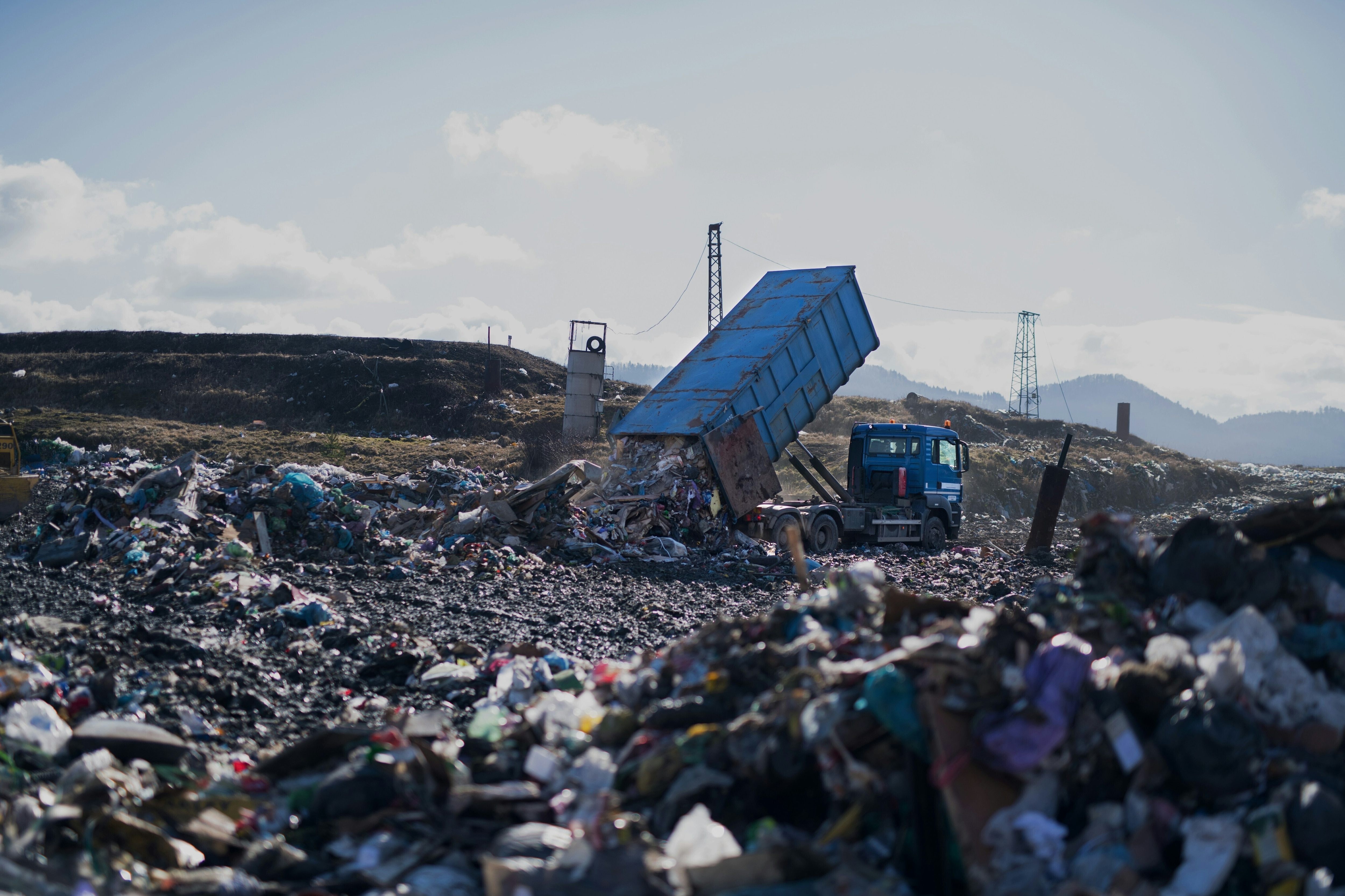 A landfill site with truck tipping out more non-recyclable waste: EPR is becoming central to global packaging and circularity efforts