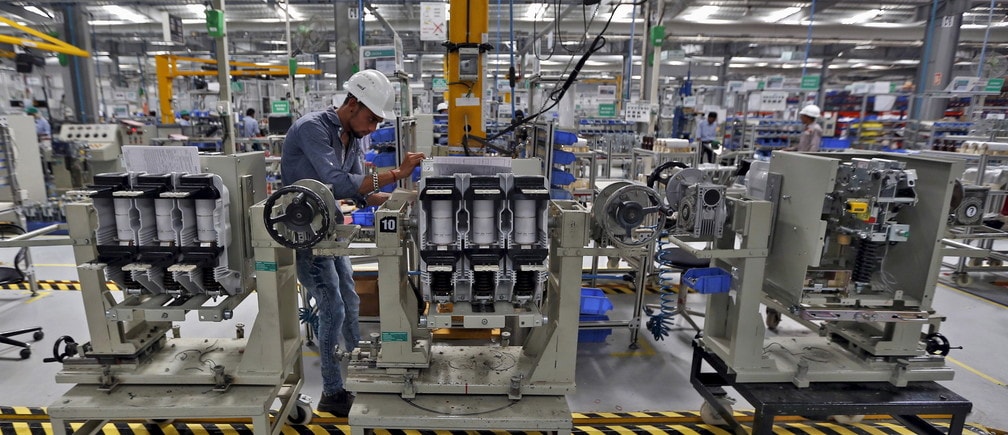 An employee assembles medium voltage switchgears inside the plant of Schneider Electric Infrastructure Ltd. on the outskirts of Vadodara in Gujarat, India, November 5, 2015