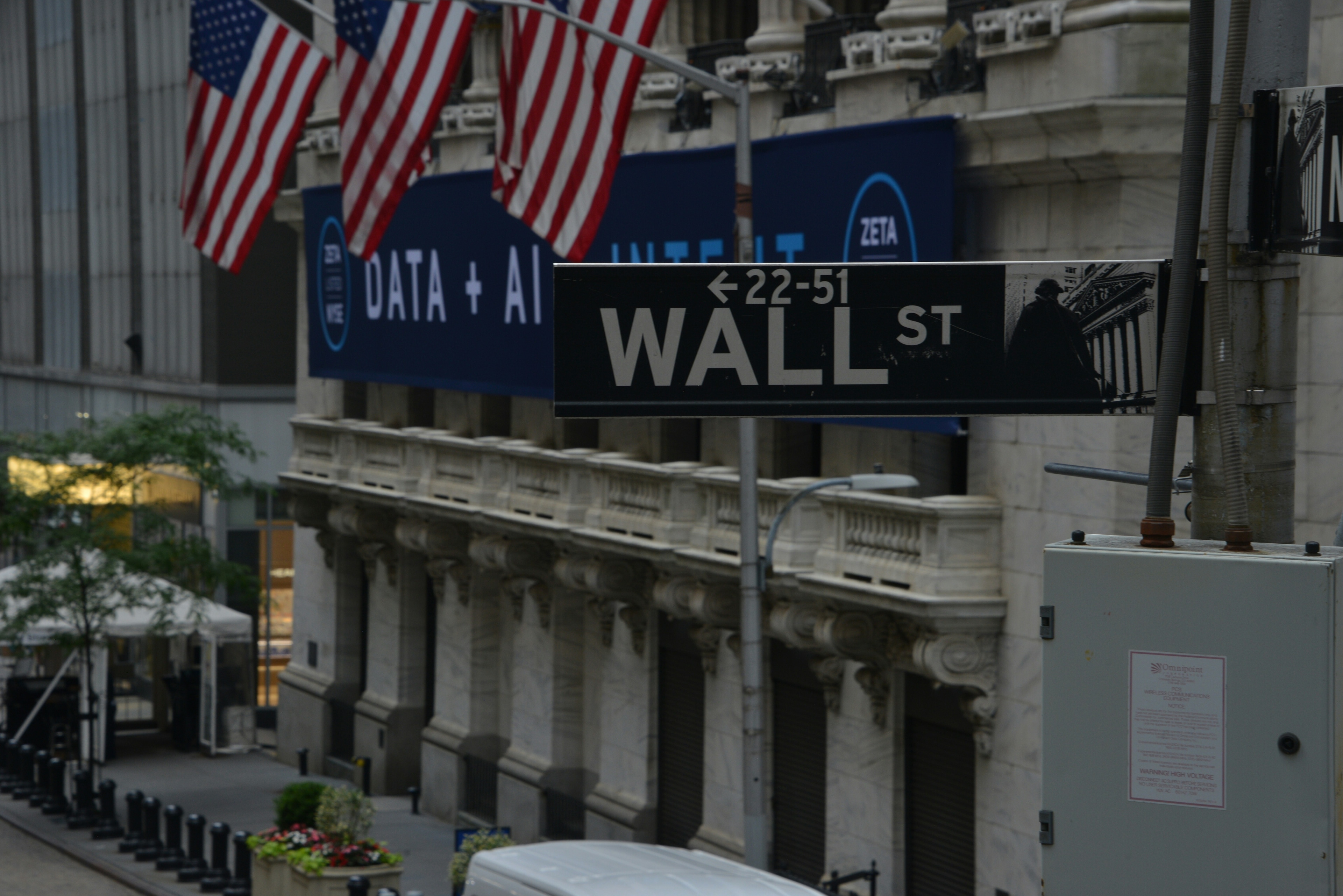 Illustrative image of Wall Street in New York City. Many private equity firms are planning to multiply AI investments in the coming year.