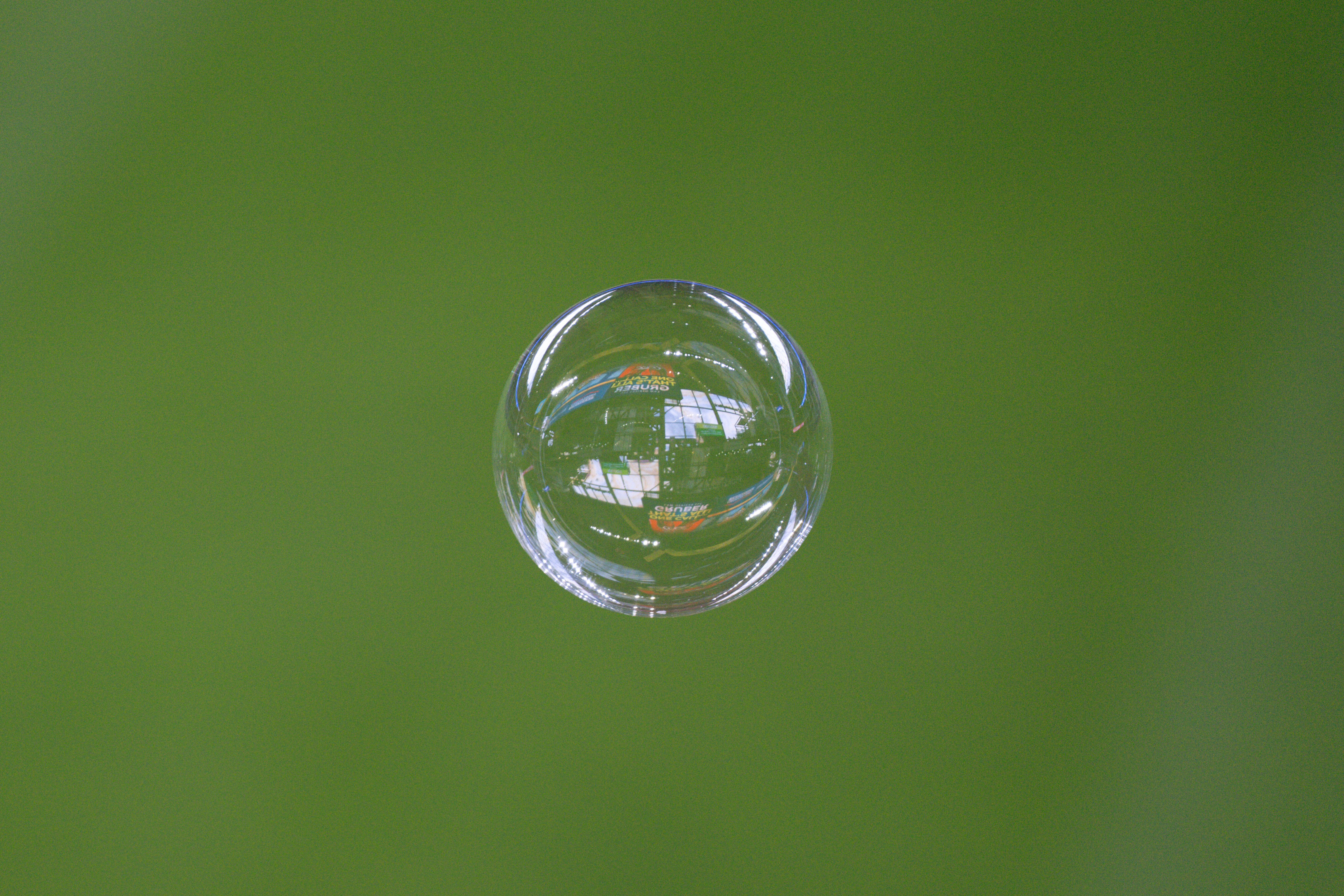 Jun 12, 2025; Milwaukee, Wisconsin, USA;  A reflection of American Family Field is seen in a bubble prior to the game between the St. Louis Cardinals and Milwaukee Brewers. Mandatory Credit: Jeff Hanisch-Imagn Images