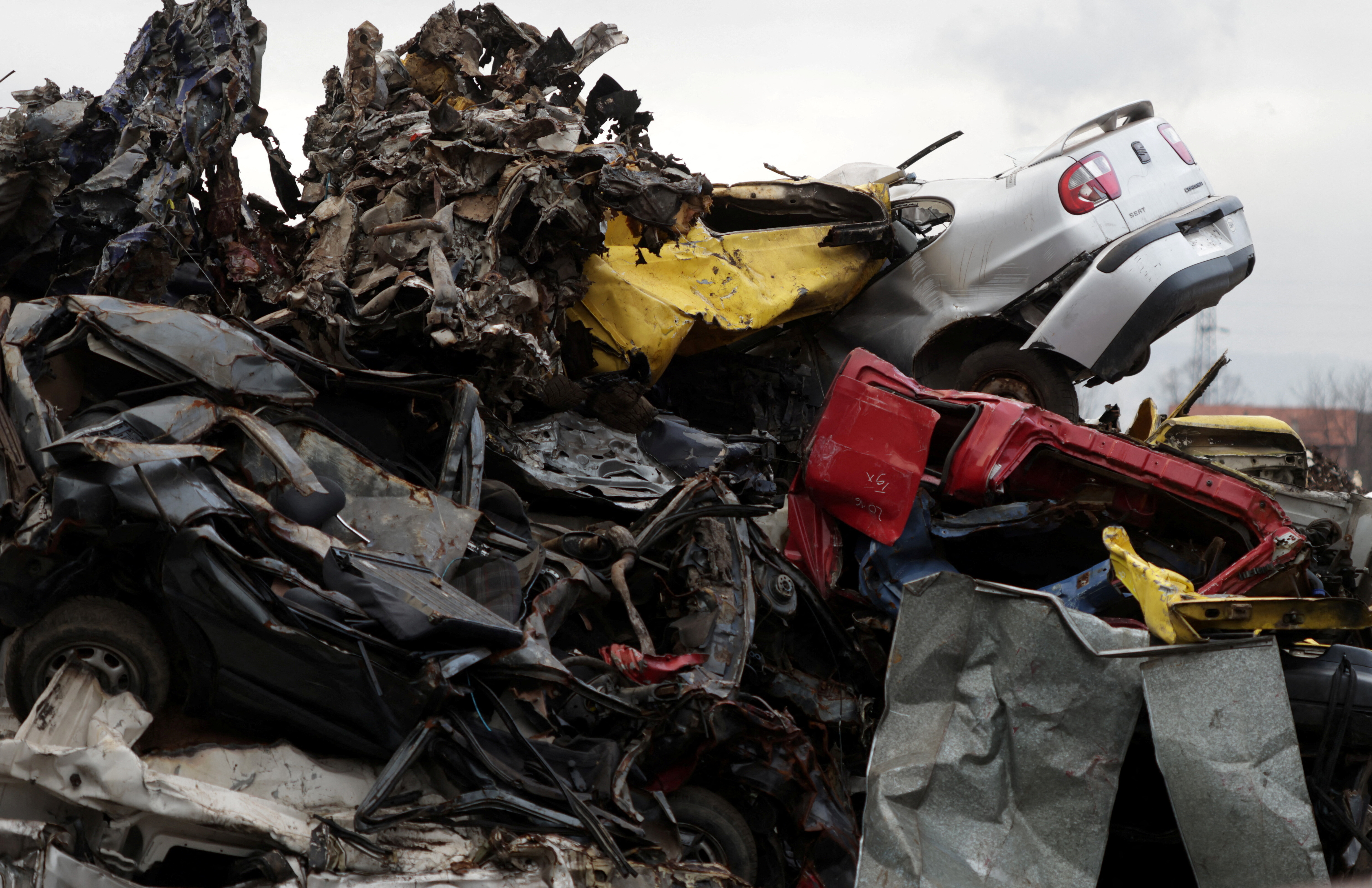Cars prepared for recycling are seen on car waste in Zenica, Bosnia and Herzegovina, February 21, 2024: Automotive plastics is a growing challenge with very little recycled.
