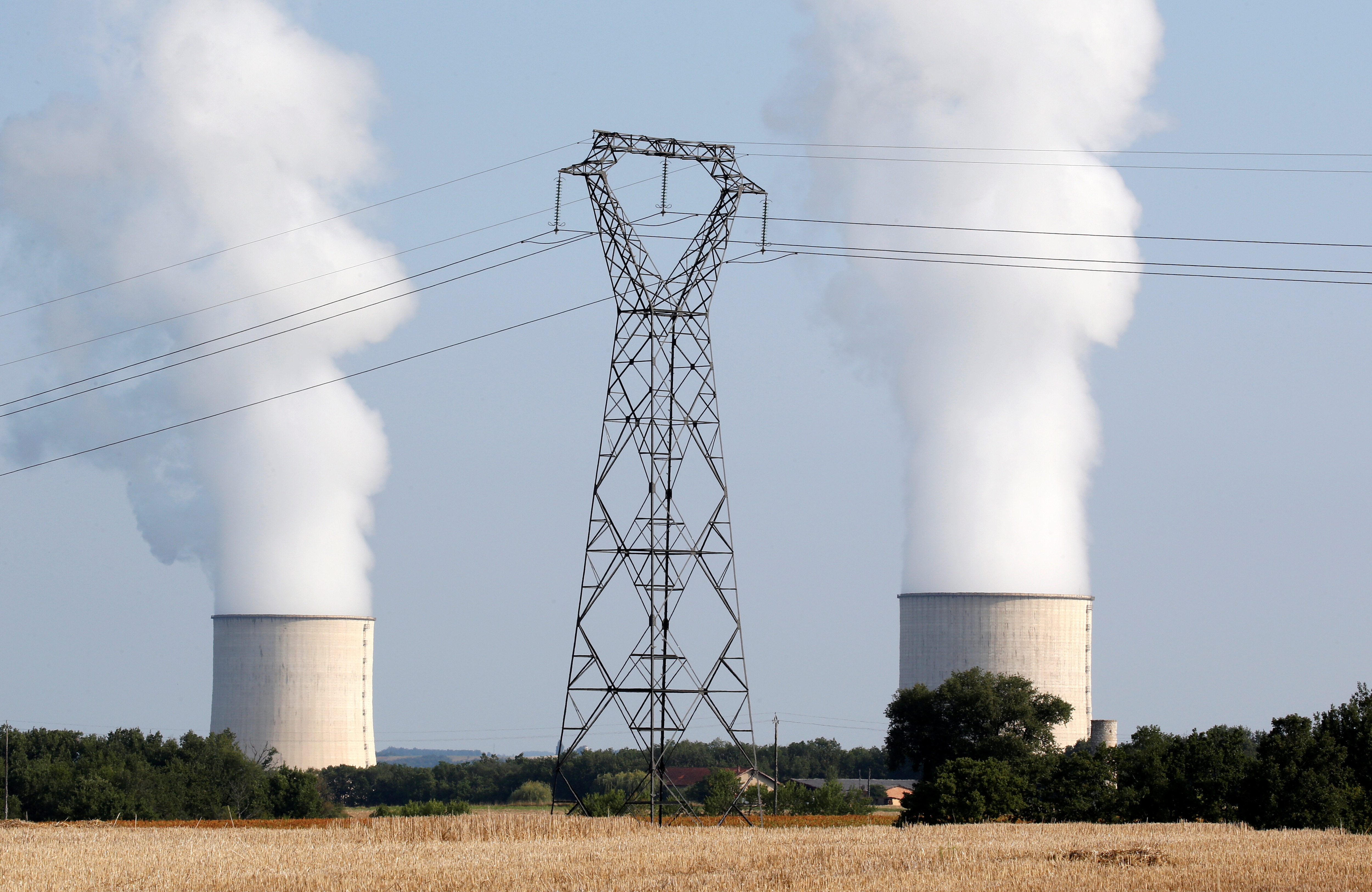 The cooling towers and high-tension electrical power lines are seen near  the Golfech nuclear plant on the border of the Garonne River between Agen and Toulouse, France, August 29, 2019: There is corporate demand for low-carbon solutions to aid decarbonization, now we must turn to supply