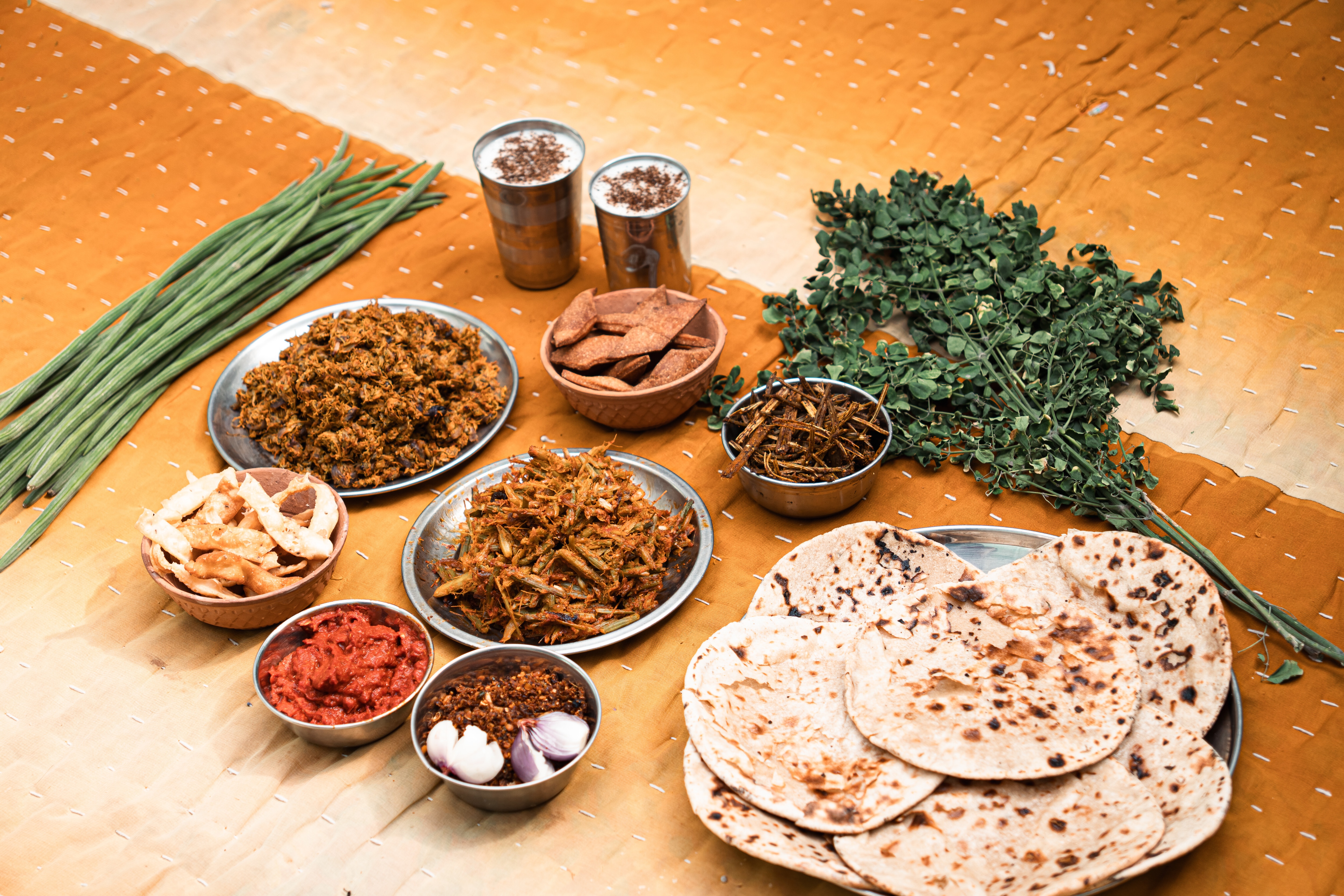 A seasonal moringa (sahajan) spread from Rajasthan, featuring sahajan ke phoolon ki sabji (moringa flowers), sahajan ki phali ki sabji (moringa bean/ drumsticks) and an achaar made from its pods and leaves: Past cultures and traditions show the benefits of seasonal eating rather a year-round diet