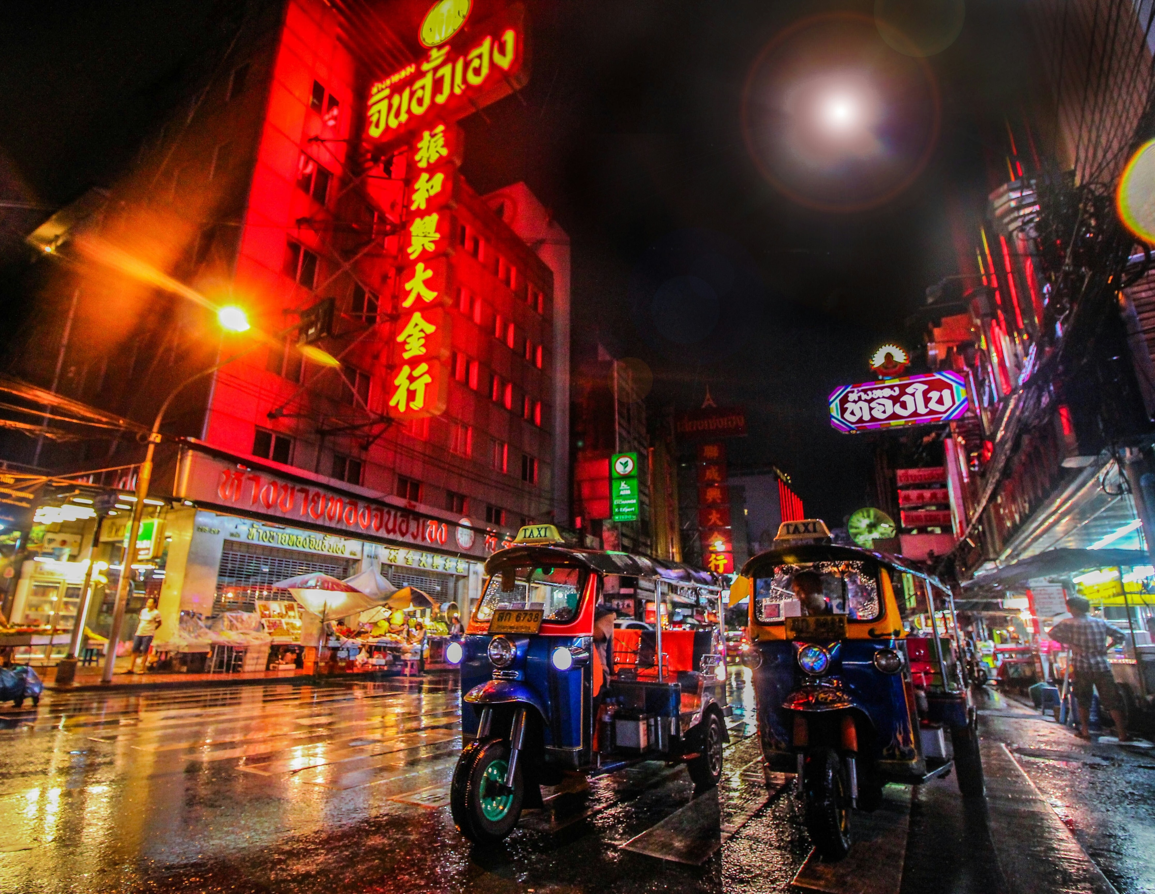 A night time view of a Bangkok street, one of many inclusive cities.