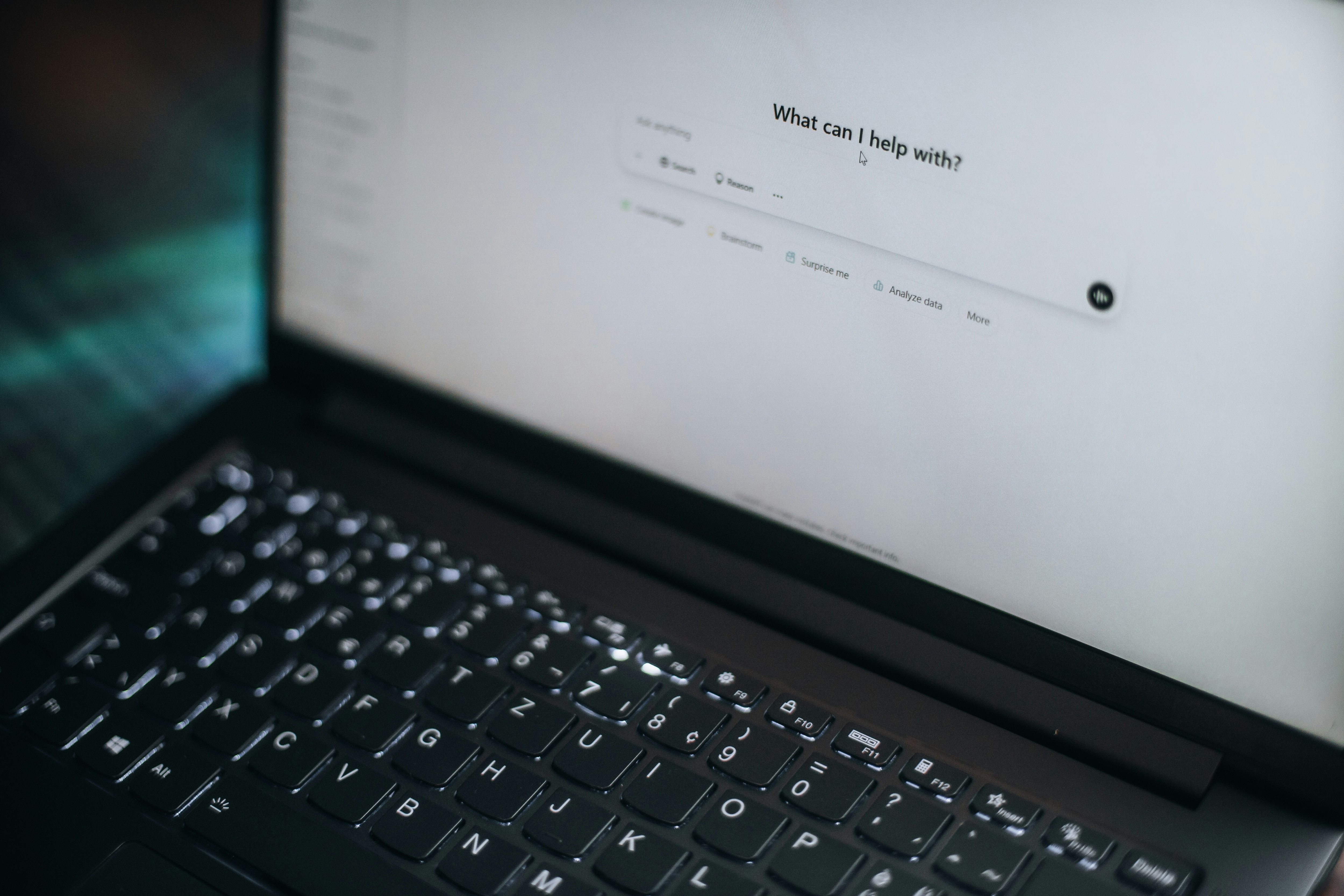 A laptop computer with an AI prompt.