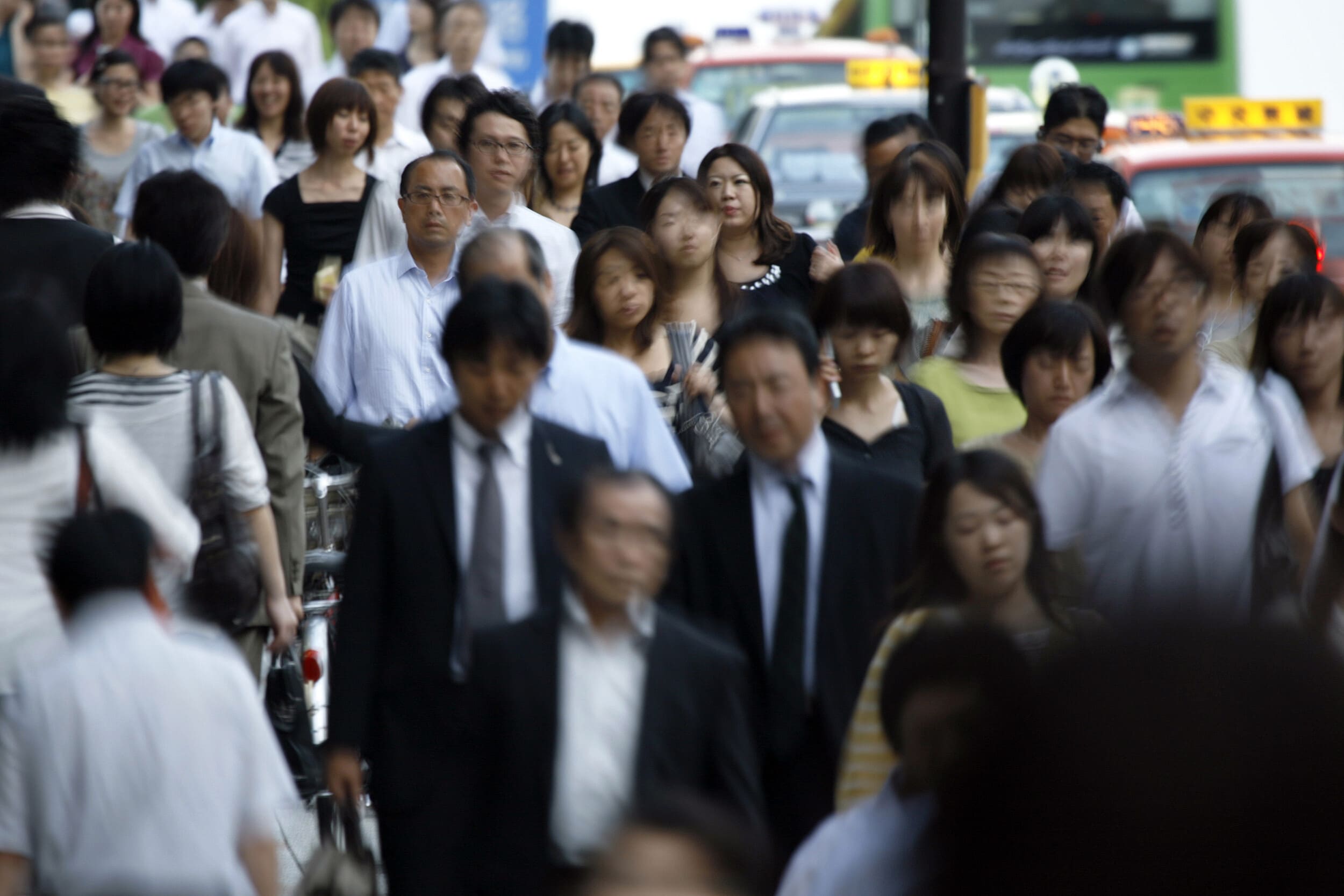 Pedestrians walk on a street in Tokyo August 3, 2009: Companies are beginning to see the value in recruiting and upskilling the 'employment ice age generation' 