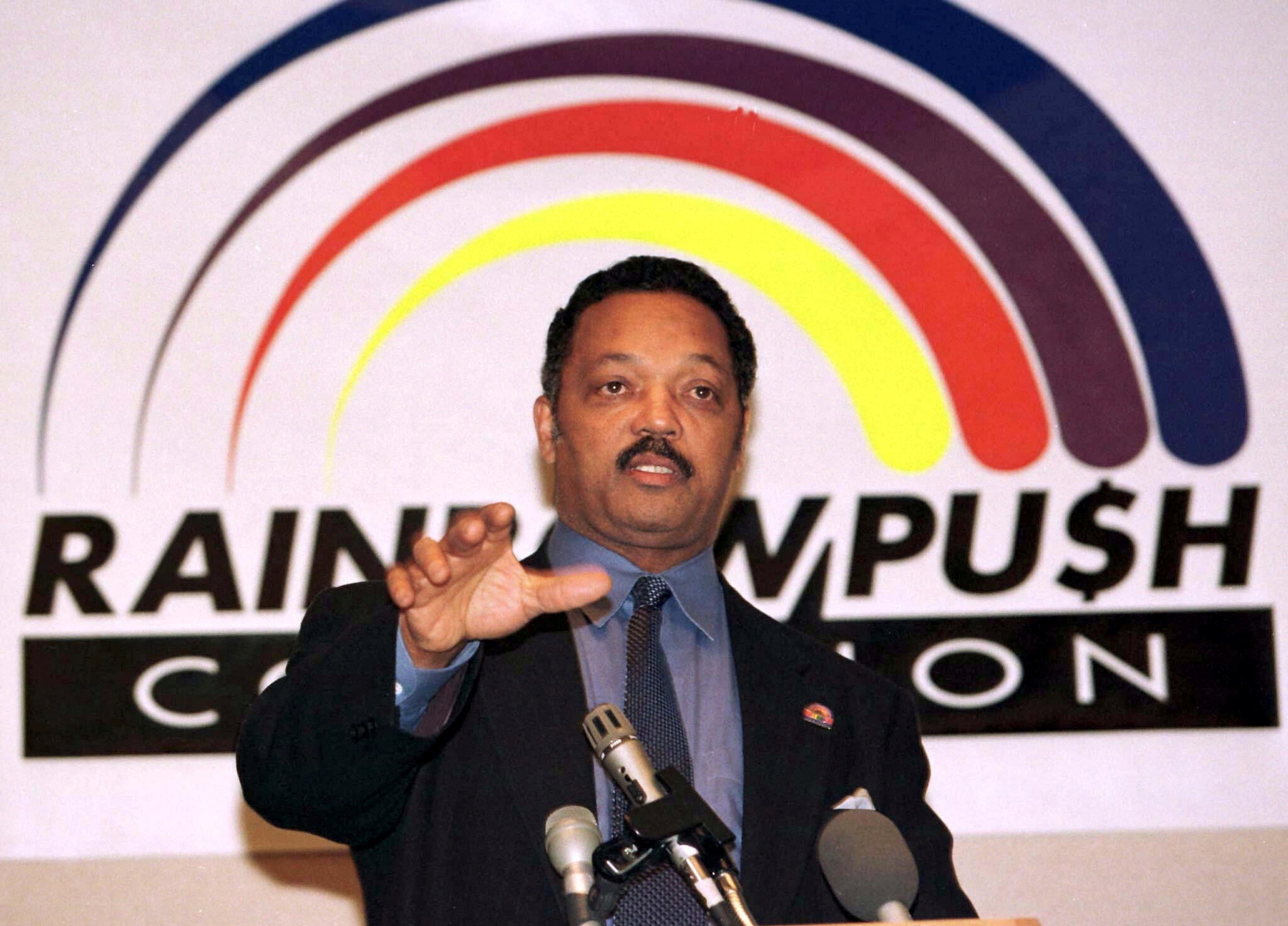FILE PHOTO: Rev. Jesse Jackson speaks at a news conference in New York, U.S. January 15, 1997 to announce an accord on the boycott of Mitsubishi Motors products and the company's work force diversity efforts. Jackson also announced that his Rainbow PUSH Coalition will open a Wall Street office to monitor how corporate America offers opportunities to minorities and lead boycotts if necessary. REUTERS/Mike Segar/File Photo