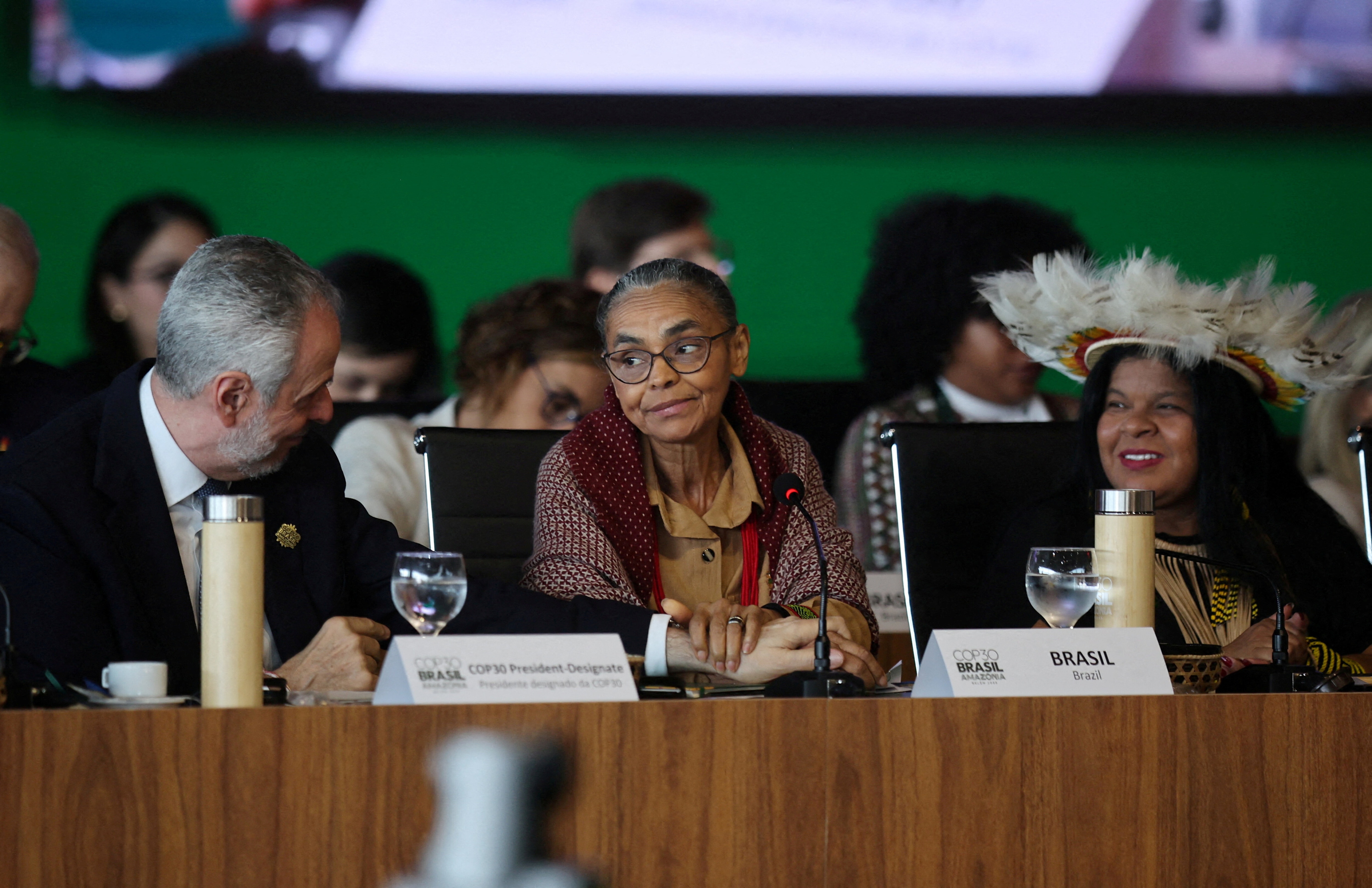 Brazil's COP30 President Andre Correa do Lago, Brazil's Minister of the Environment and Climate Change, Marina Silva and Brazil's Minister of Indigenous Peoples Sonia Guajajara, attend the ministerial preparatory meeting (Pre-COP30), ahead of the COP30 Climate Summit, in Brasilia, Brazil October 13, 2025. REUTERS/Mateus Bonomi/File Photo