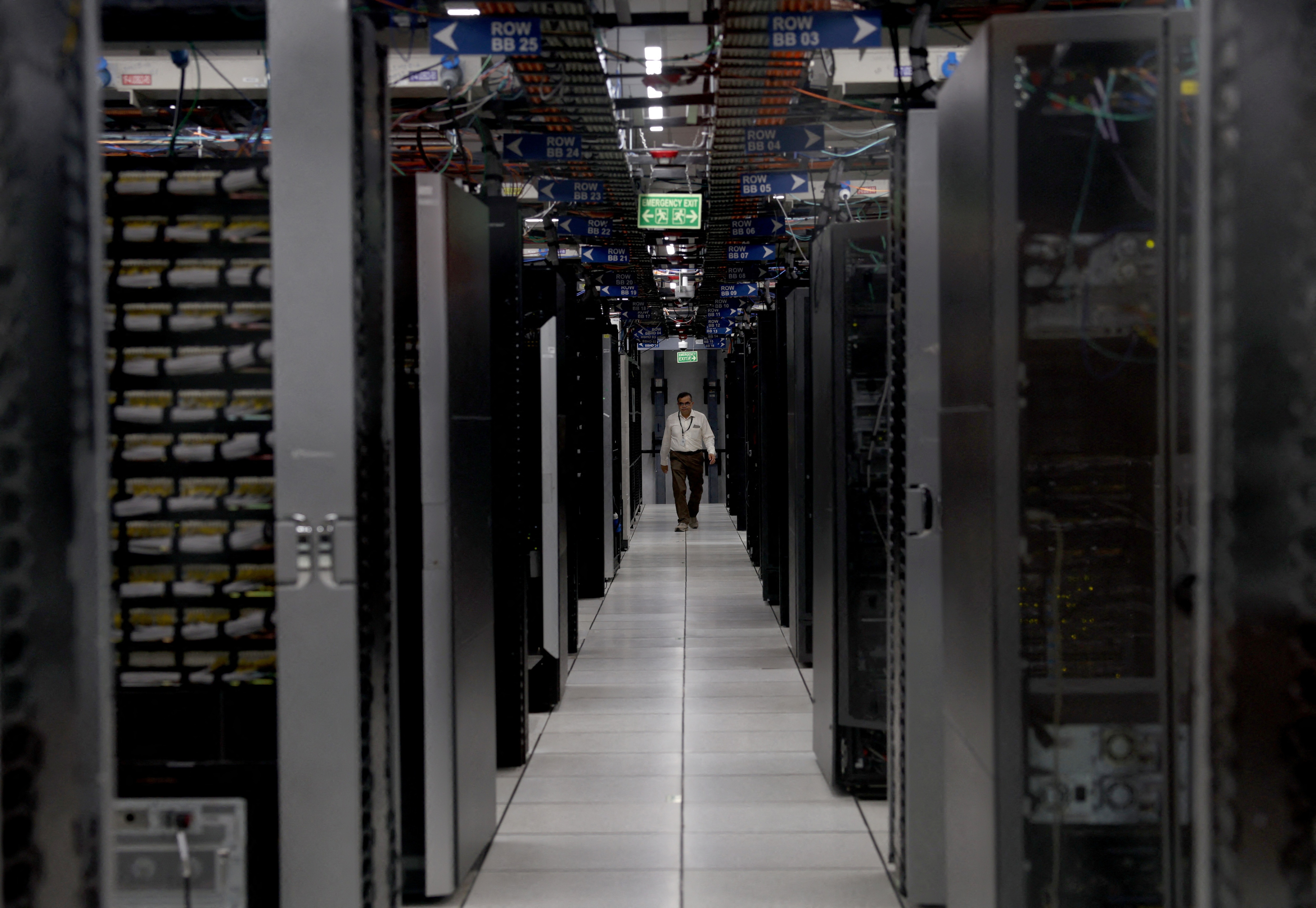 An employee walks through a data centre of Hewlett Packard Enterprise (HPE) inside its office building in Bengaluru, India.