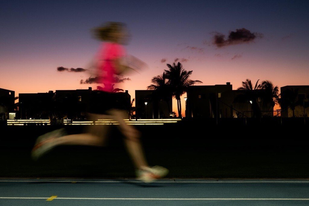 A woman is seen jogging.