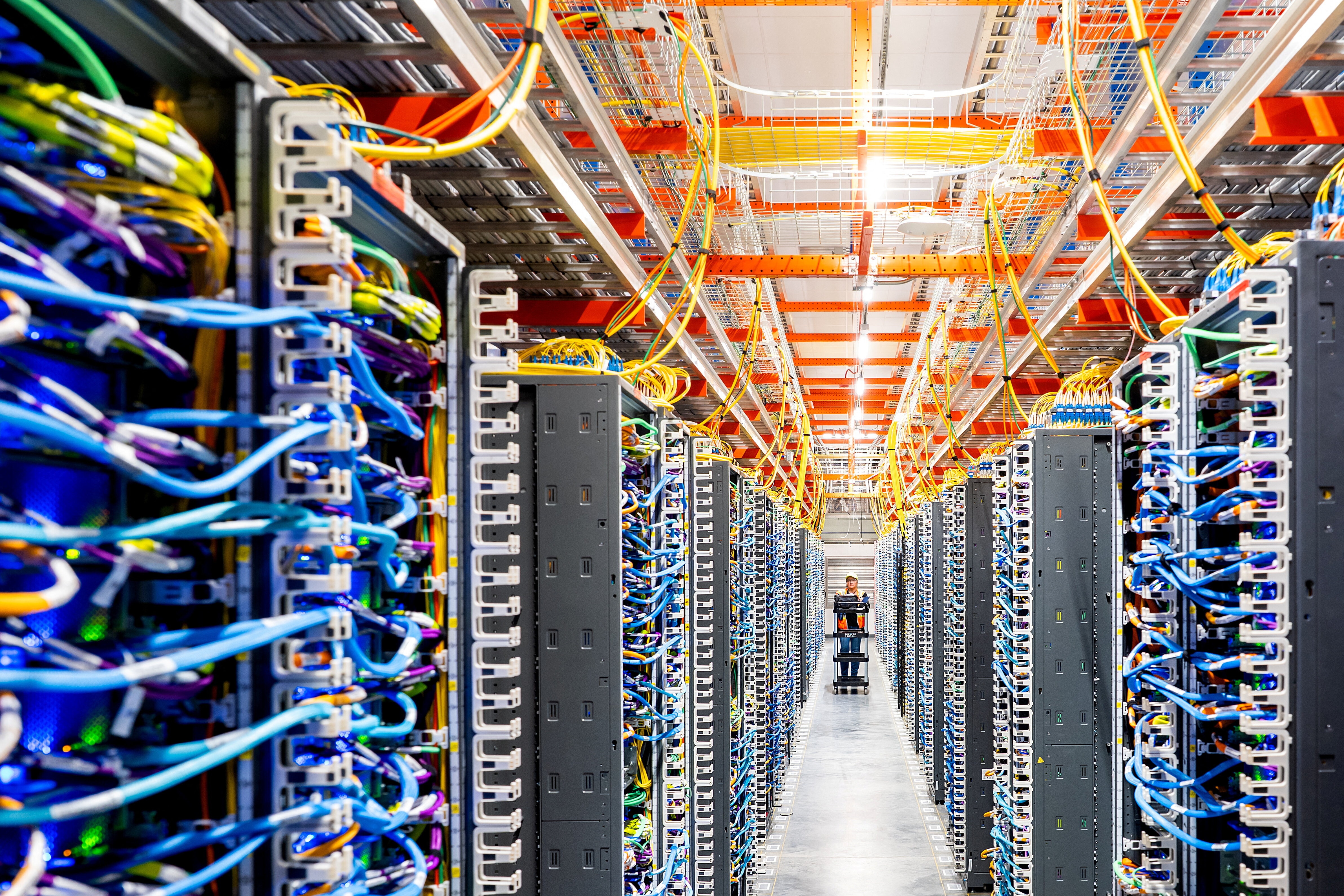 A technician works at an Amazon Web Services AI data center in New Carlisle, Indiana, U.S., October 2, 2025. It is crucial that we square AI's economic potential with the demands it places on our water systems.