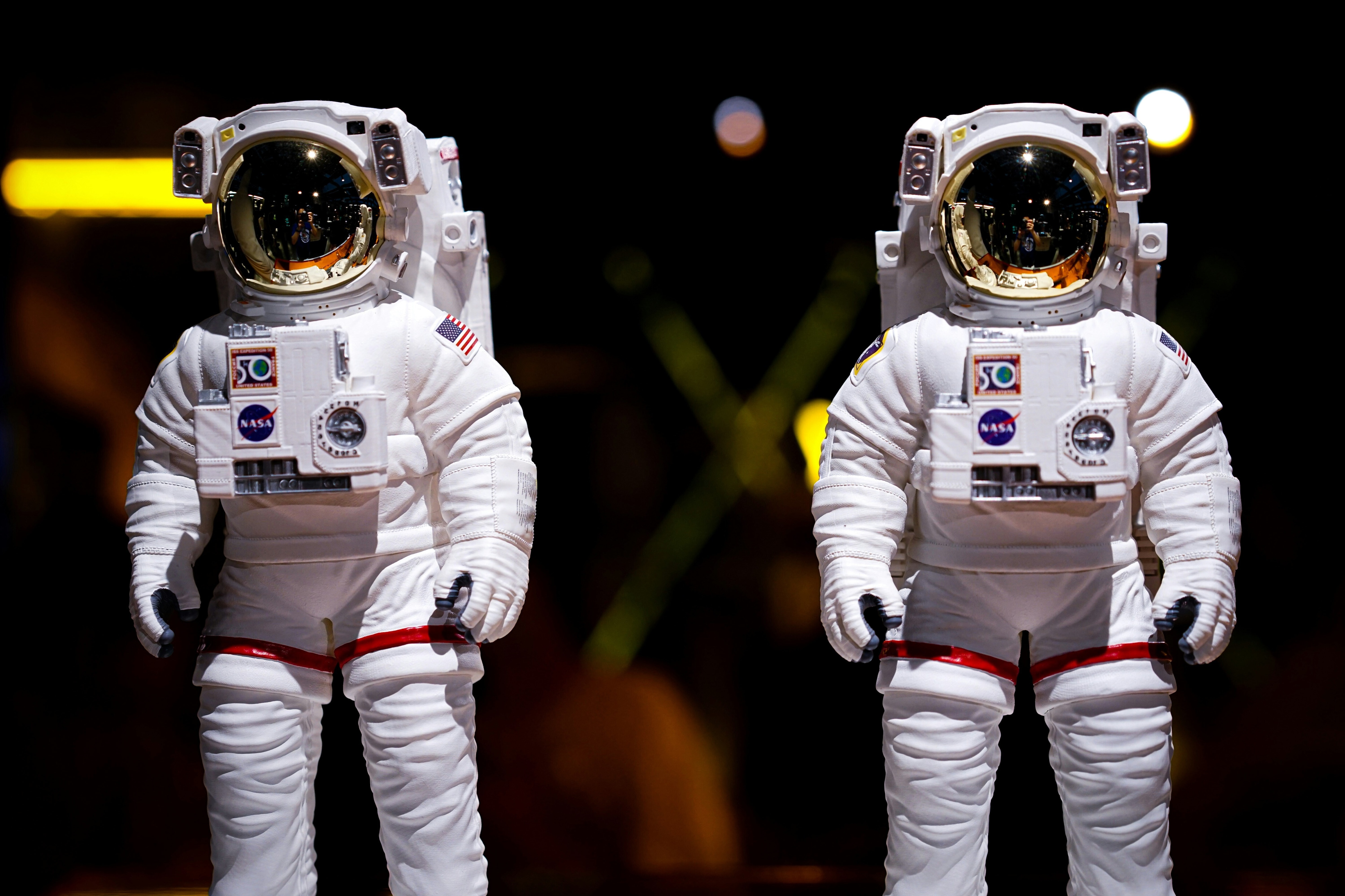 Two astronauts in white space uniforms with helmets on: If deep space exploration is possible, is time to prepare?