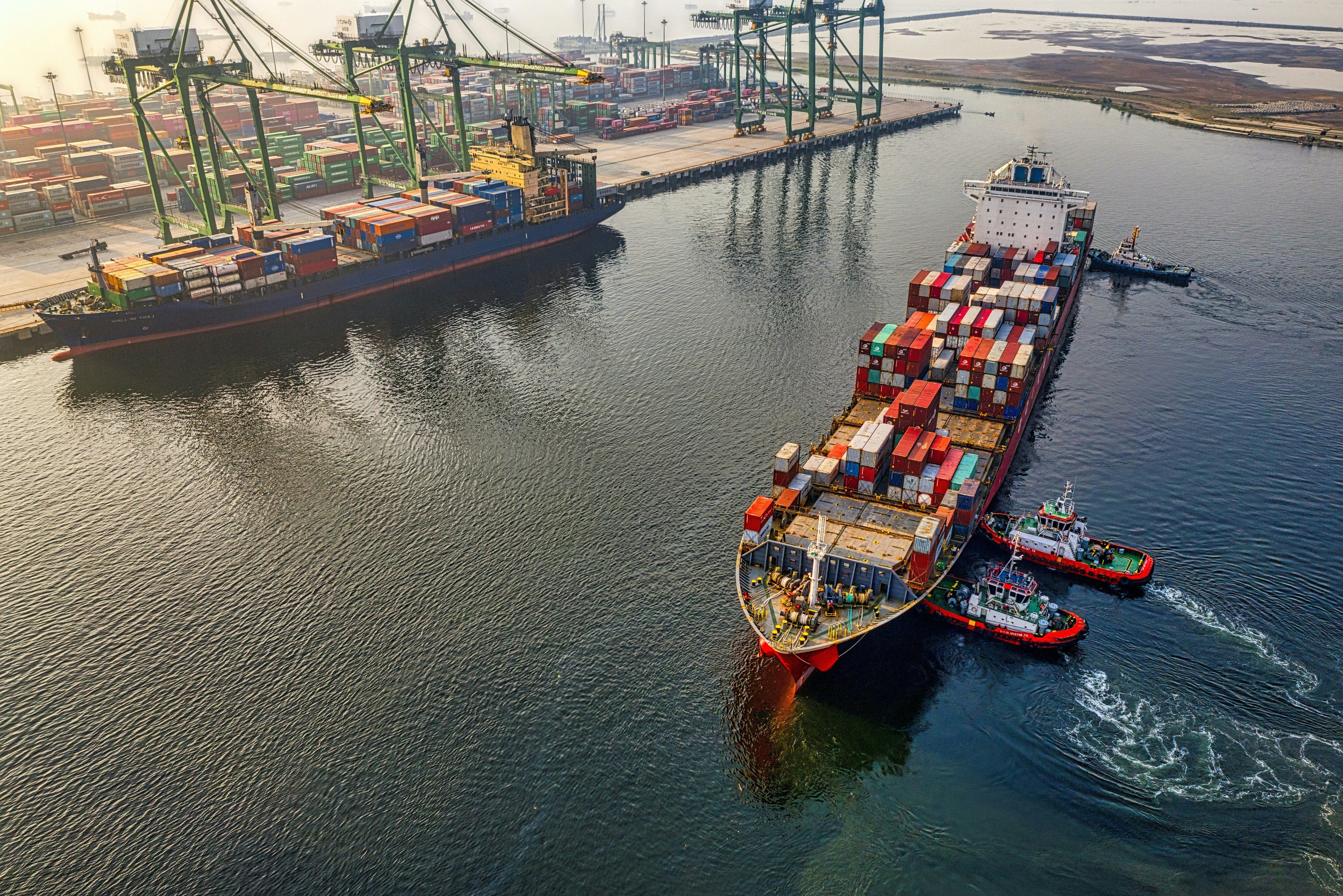 Cargo ships on water during daytime.