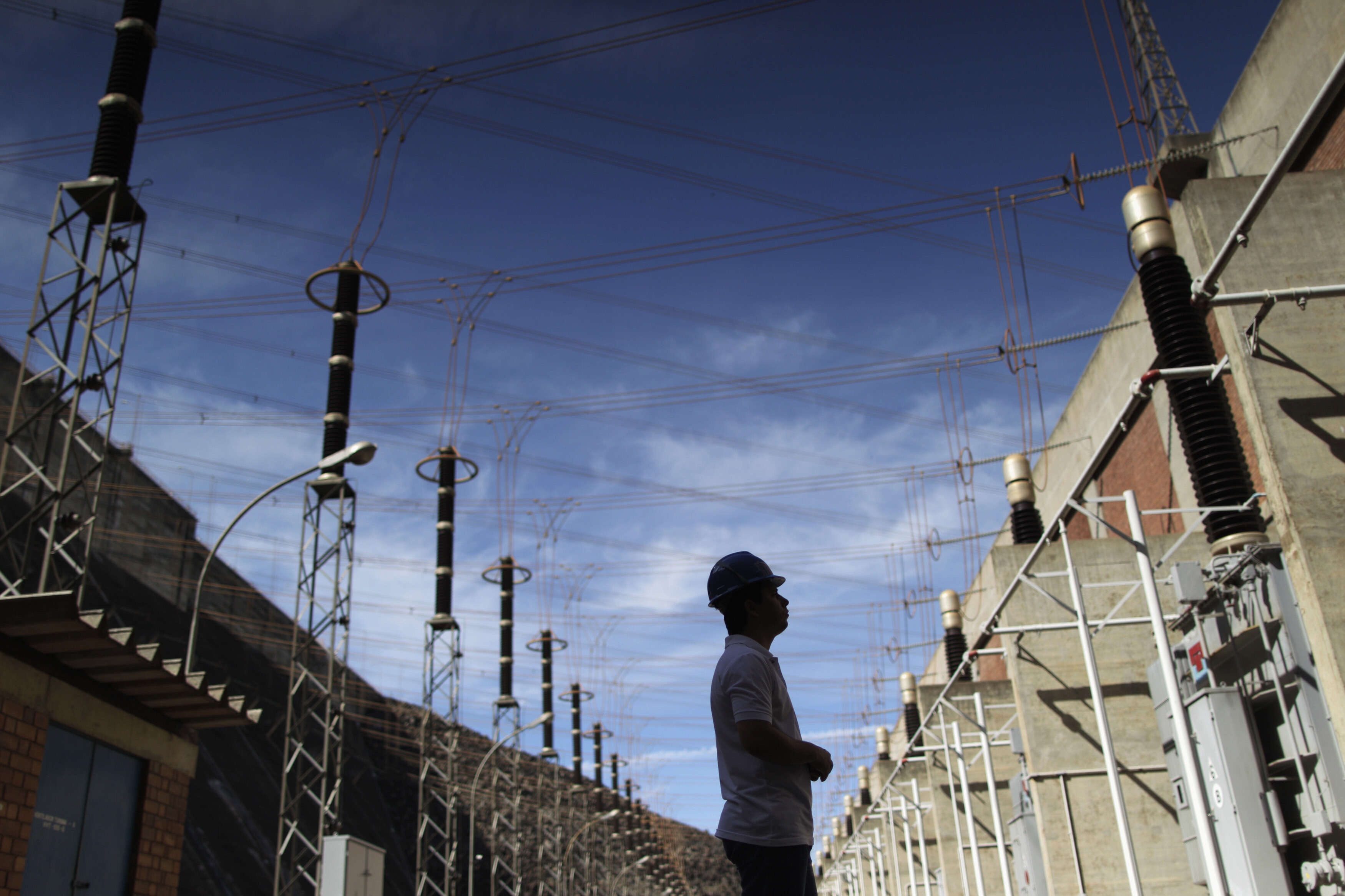 A worker stands inside the Itumbiara hydroelectric dam, running at only 9 percent of capacity due to low water levels, according to the dam's operator, in the city of Itumbiara on the border between the states of Goias and Minas Gerais in Central Brazil, January 9, 2013: Latin America’s power systems need significantly more investment