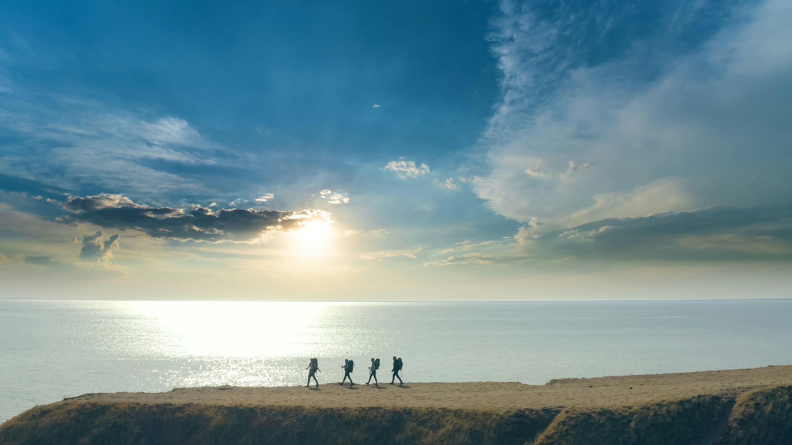 People walk across a seascape: Landscapes and seascapes benefit society but financing addresses short-term fixes rather than long-term resilience