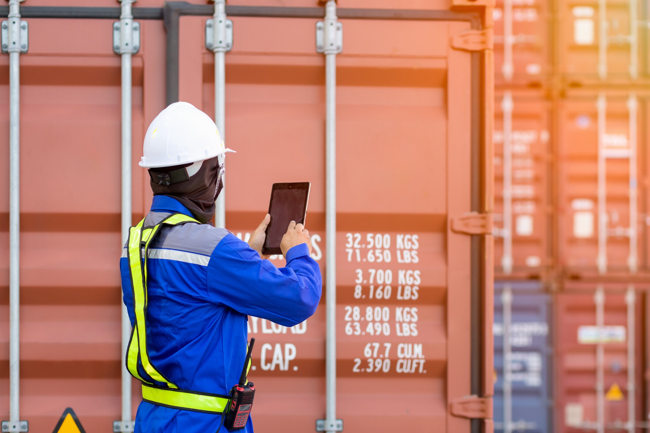 Foreman control loading Containers box from Cargo freight ship,Freight shipping containers at the docks,Large container shipping at shipping yard main transportation of cargo container shipping. Digital product passport