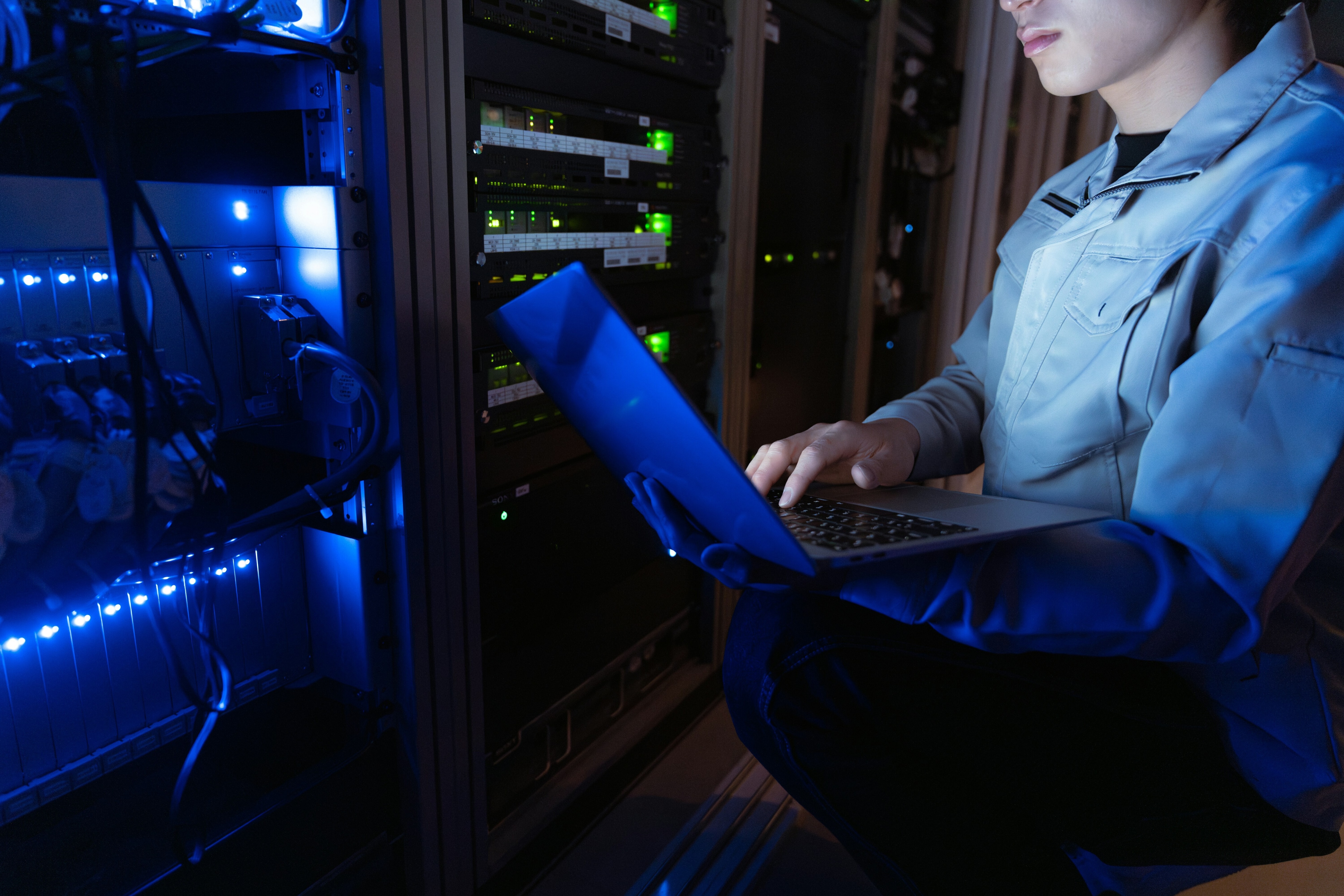 A worker at a computer server as AI bolsters cybercrime and fraud.