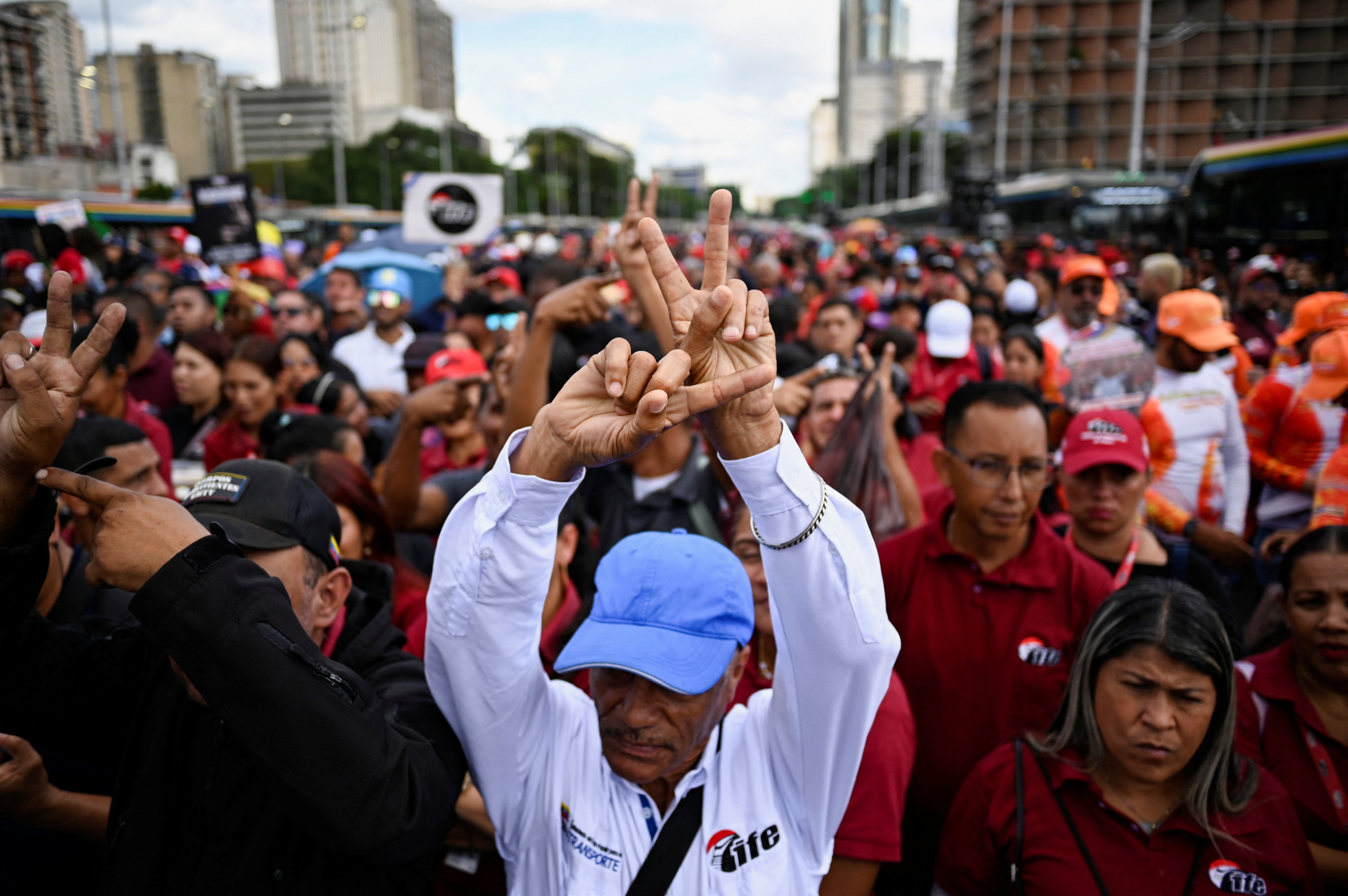 Demonstrators attend a march organized by Venezuelan transport workers in support of captured President Nicolas Maduro and his wife Cilia Flores, over a week after the U.S. launched a strike on the country, in Caracas, Venezuela January 13, 2026. REUTERS/Maxwell Briceno