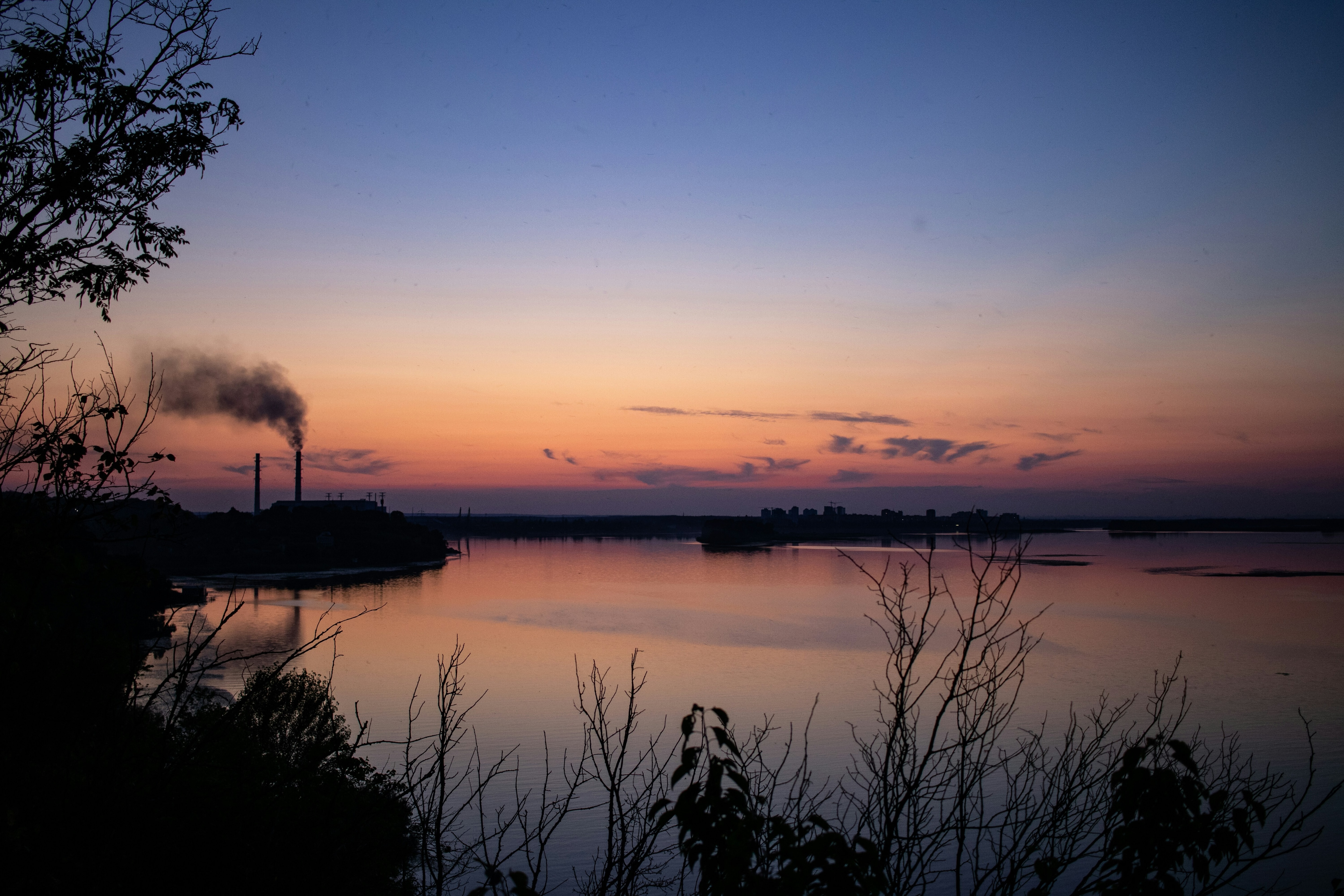 Evening, landscape, river and power plant with smoking pipes; Ukraine, energy security