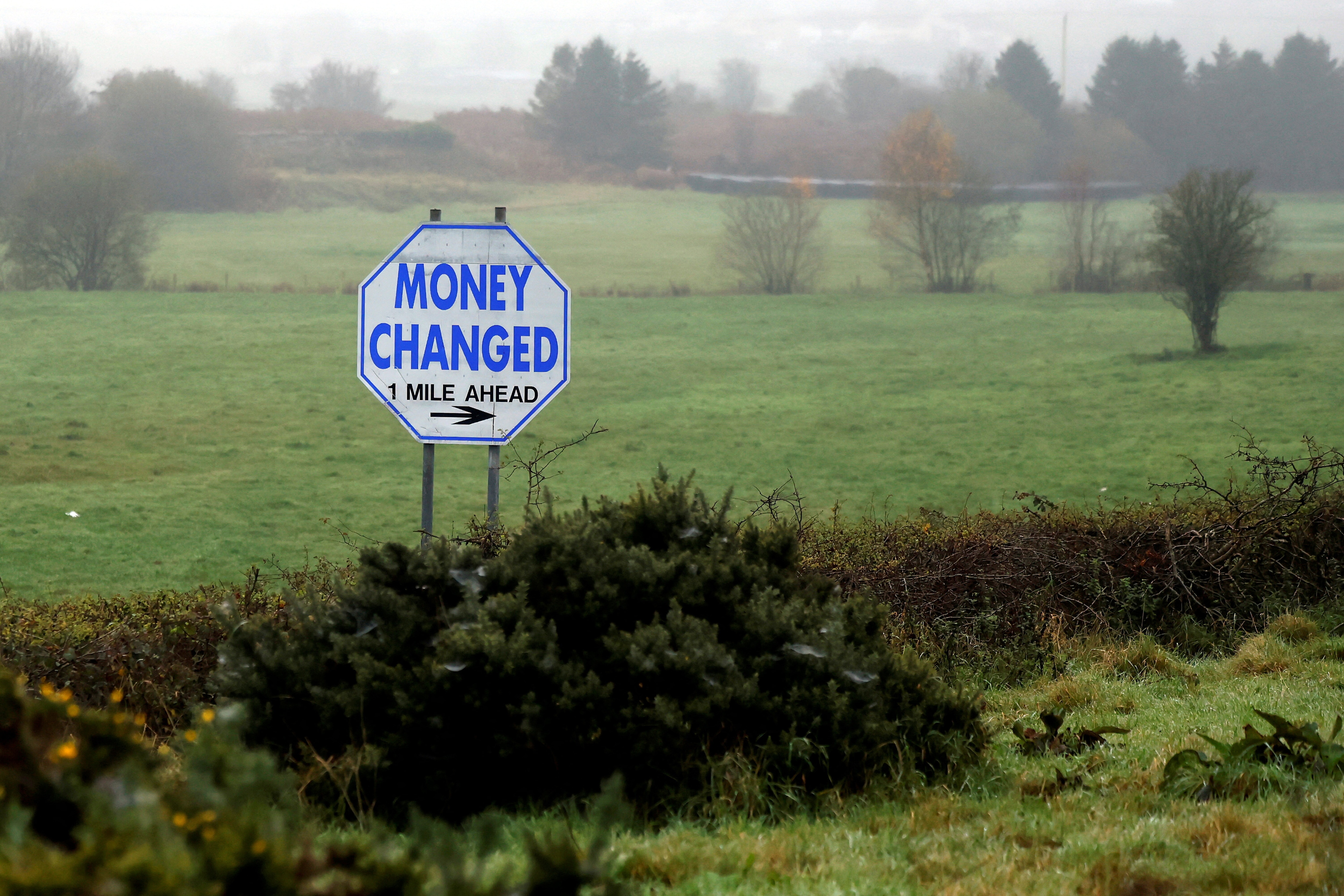 A money exchange sign is seen beside the border between Ireland and Northern Ireland, in Cloughoge, Northern Ireland November 13, 2024. REUTERS/Clodagh Kilcoyne. blockchain