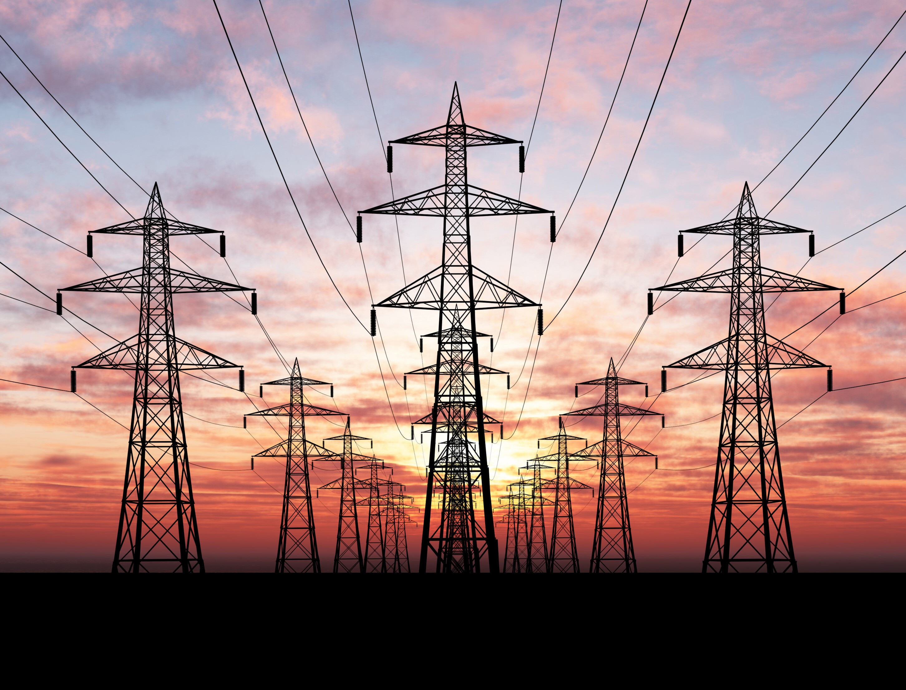 Electric power lines over sunrise; AI data centres