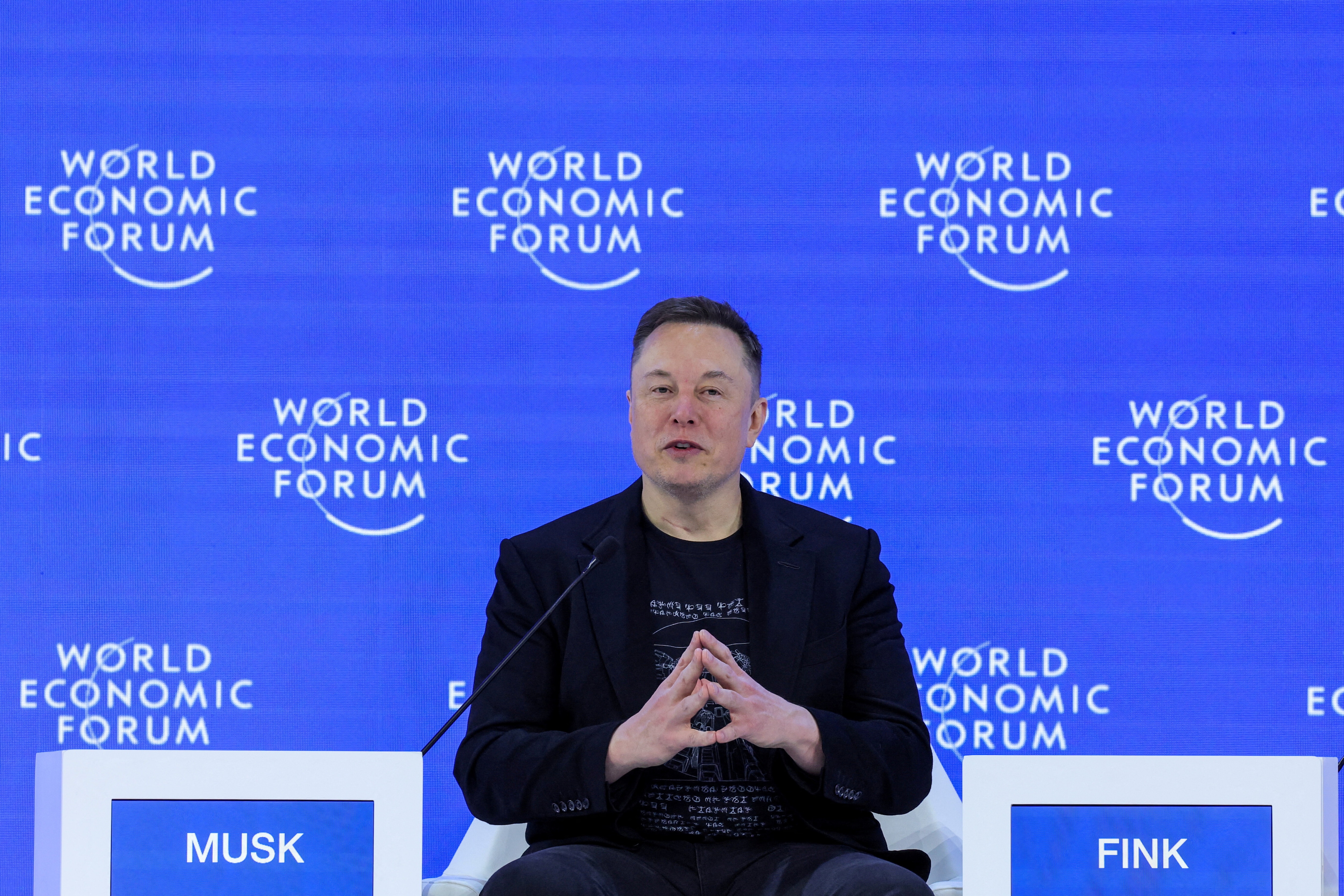 Elon Musk attends the 56th annual World Economic Forum (WEF) meeting in Davos, Switzerland, January 22, 2026: Elon Musk says AI and robotics are the pathway to abundance