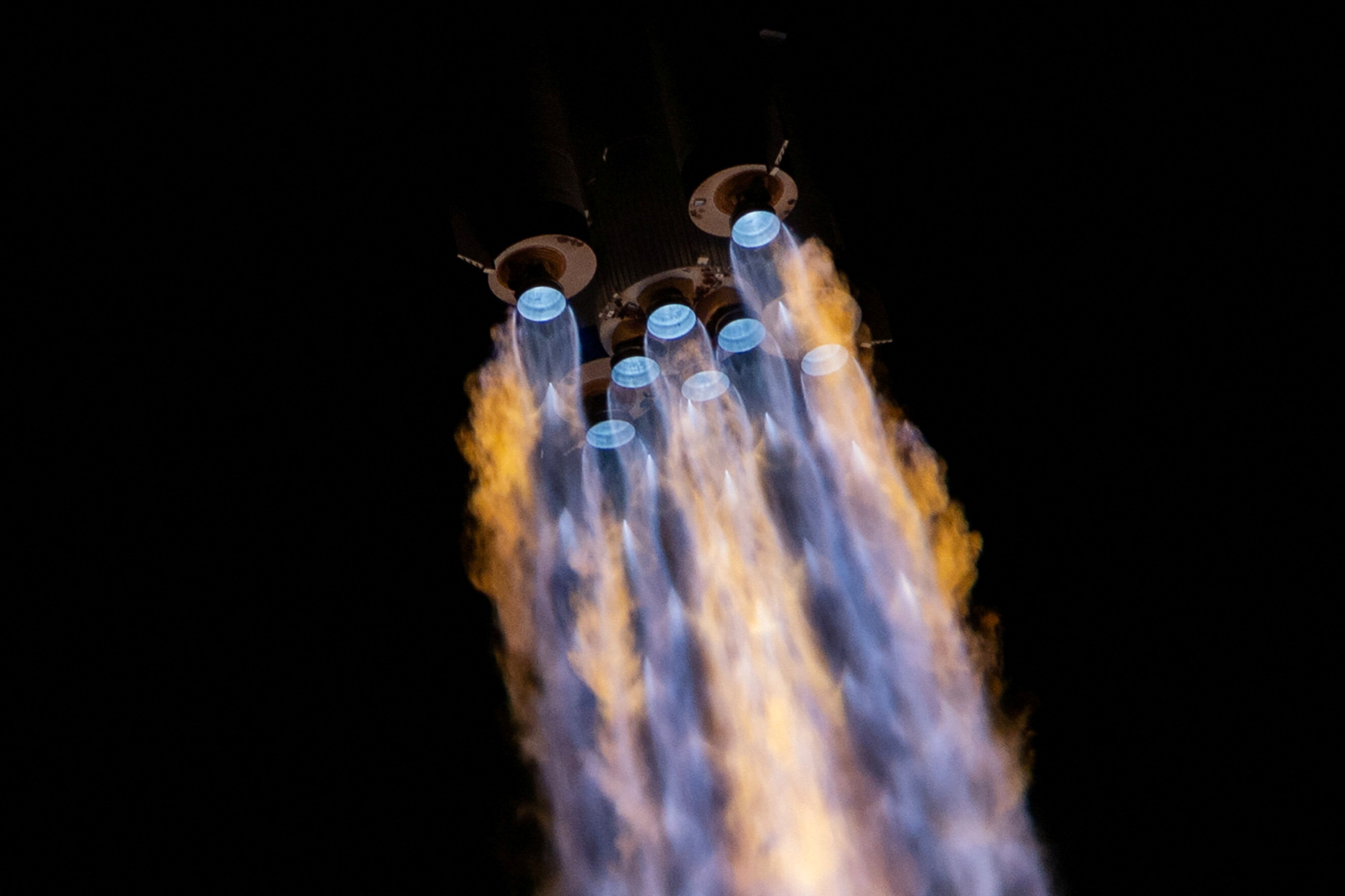 A Long March 2F rocket carrying the Shenzhou-21 space craft with astronauts Zhang Hongzhang, Zhang Lu, and Wu Fei blasts off.