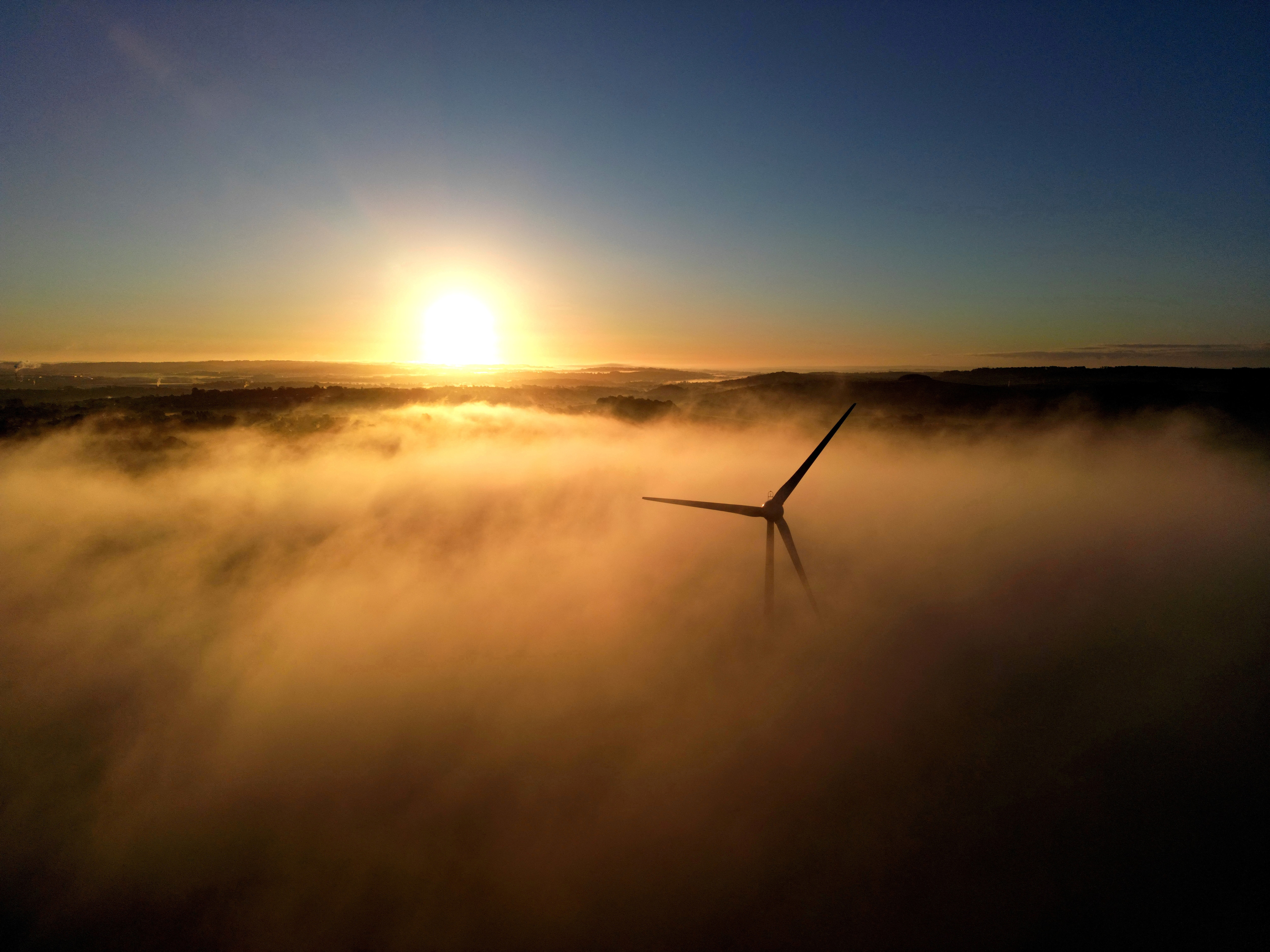  A wind turbine is shrouded in fog at the Low Carbon Energy Generation Park on the Keele University campus, Keele, Staffordshire, Britain, November 11, 2023. REUTERS/Carl Recine/File Photo