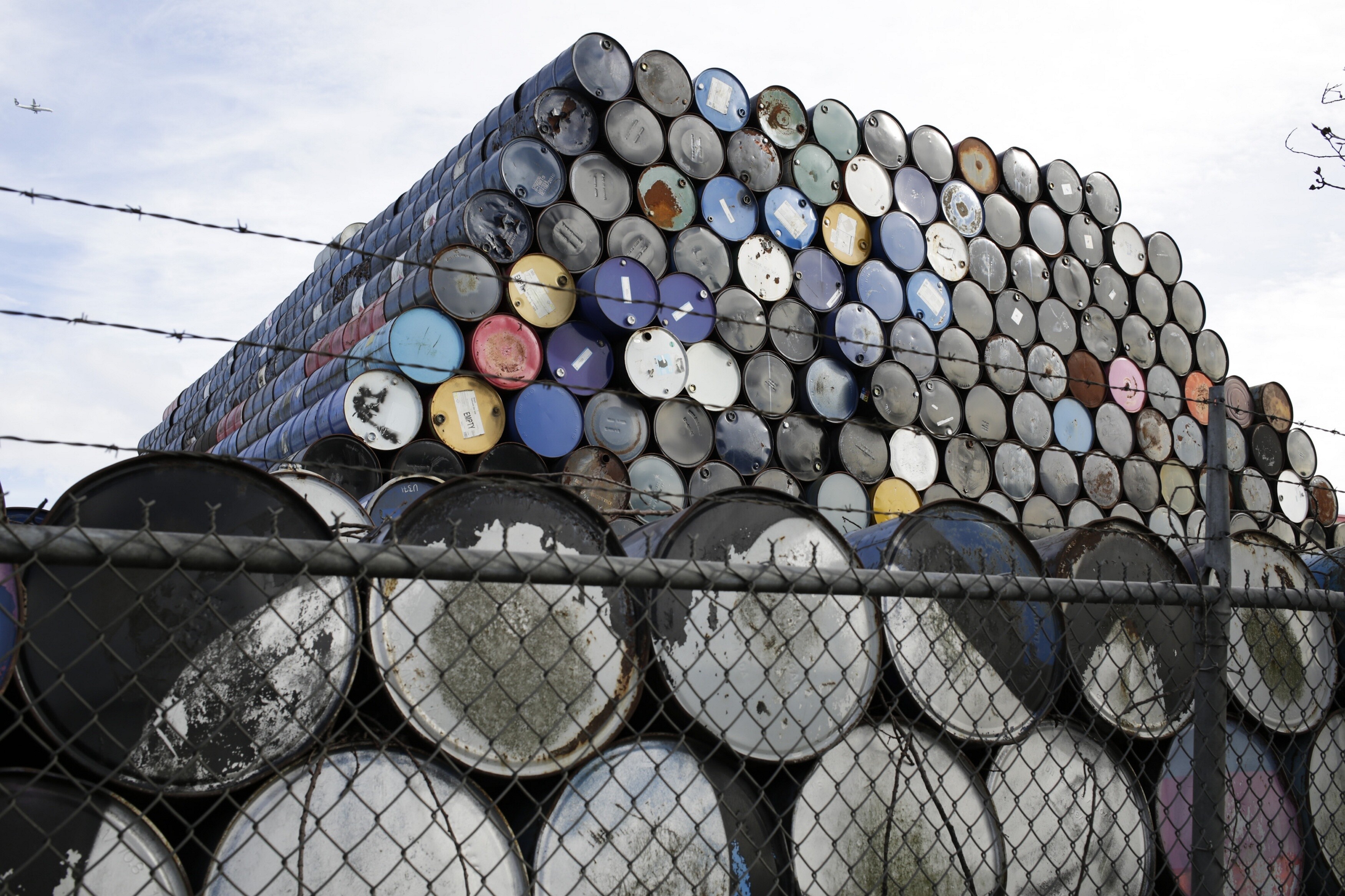 Used oil barrels are stacked at a storage facility in Seattle, Washington.