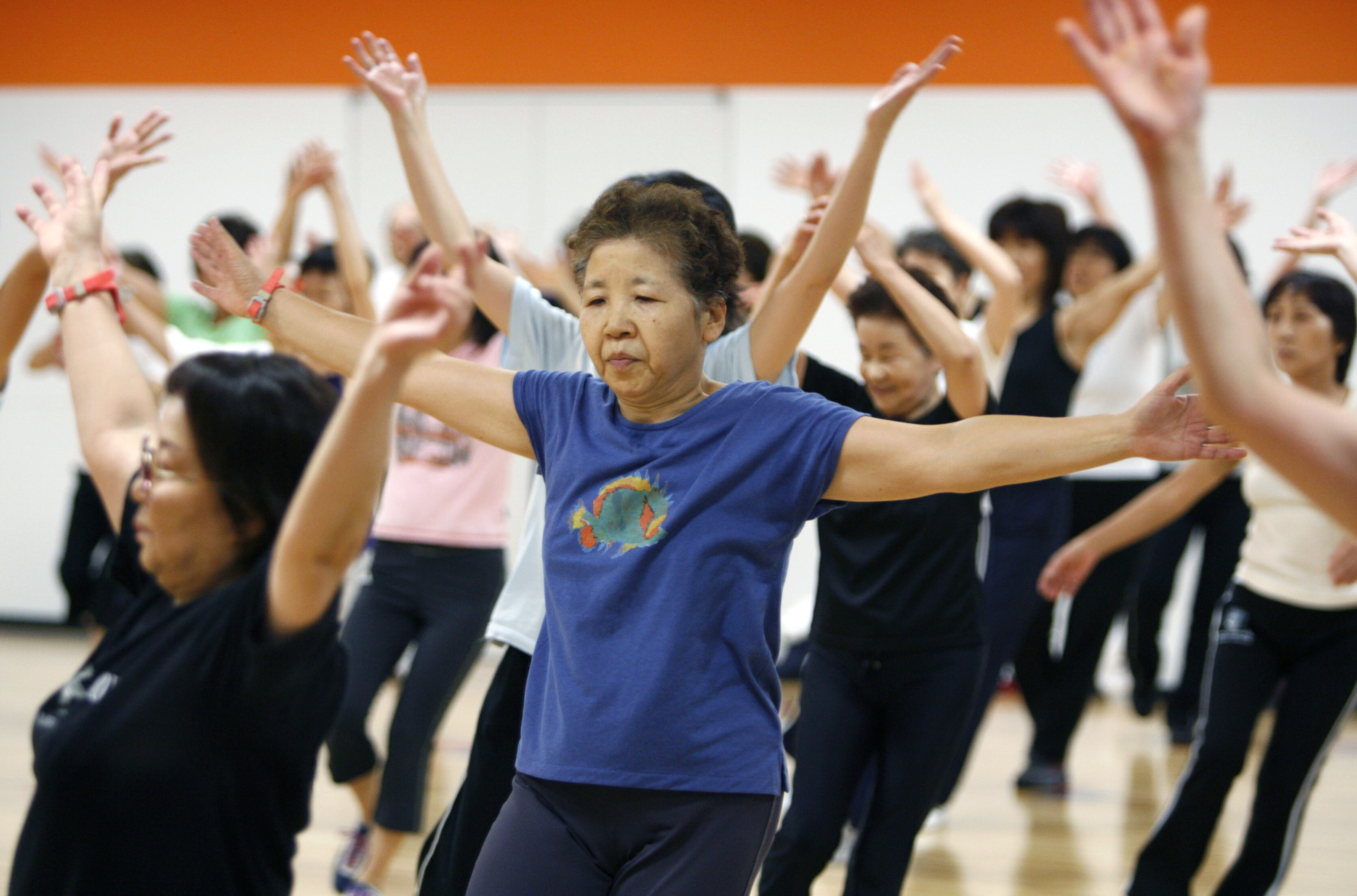 Women participate in an aerobics class at a gym in Tokyo September 4, 2007. Already, one in five Japanese are aged 65 or over and by mid-century a falling birth rate and rising longevity mean that figure will nearly double, while the population will drop by 30 percent to 90 million. Picture taken September 4, 2007: The UN Decade of Healthy Ageing was launched by WHO