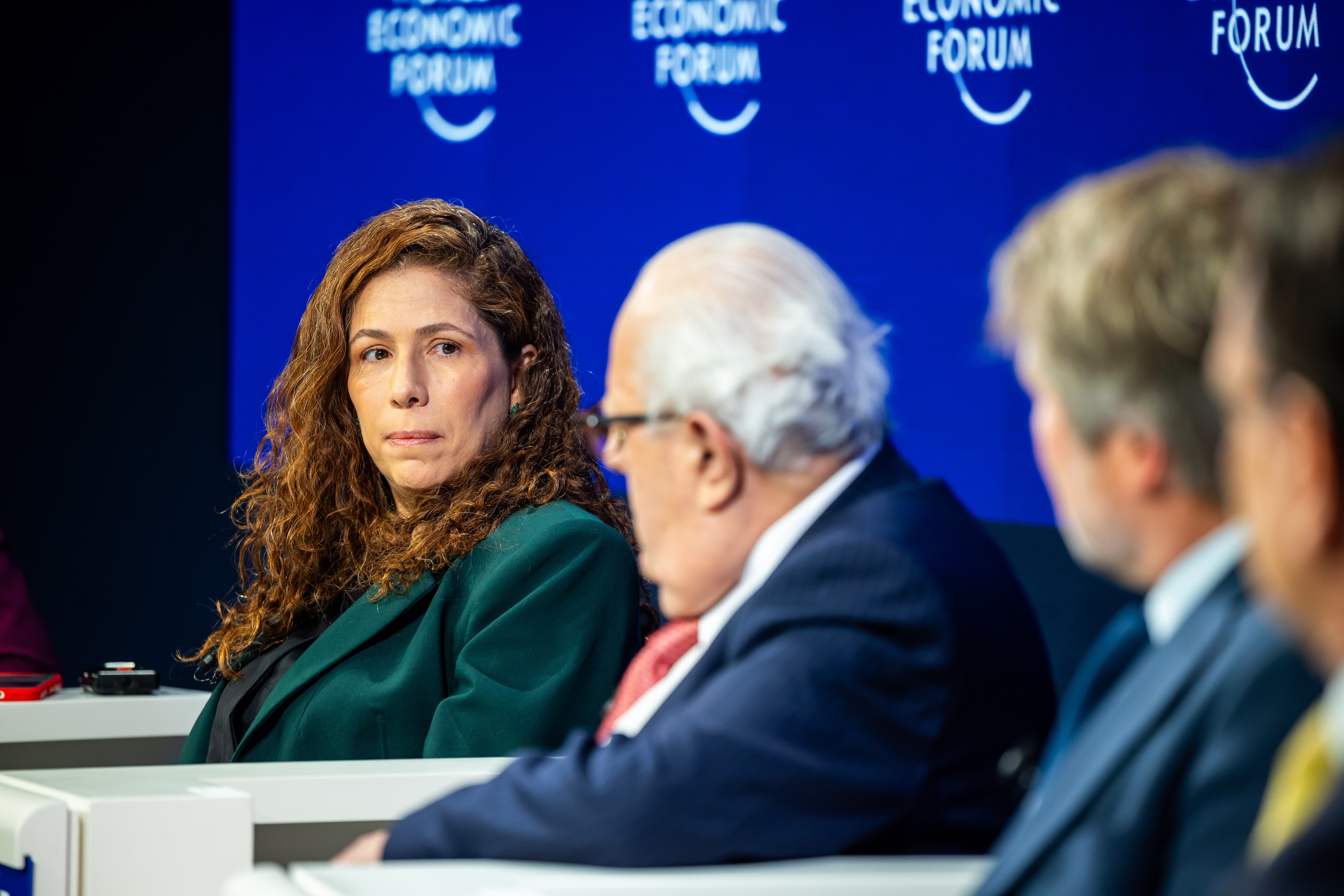 Esther Dweck, Minister of Management and Innovation in Public Services of Brazil, looks on as Julio Velarde, Governor of the Central Bank of Peru, speaks during the “Breaking Latin America’s Growth Ceiling” session, with James Scriven (IDB Invest) and Juan Carlos Mora (Bancolombia) in the background, at the World Economic Forum Annual Meeting 2026 in Davos-Klosters, Switzerland, 21 January 2026.